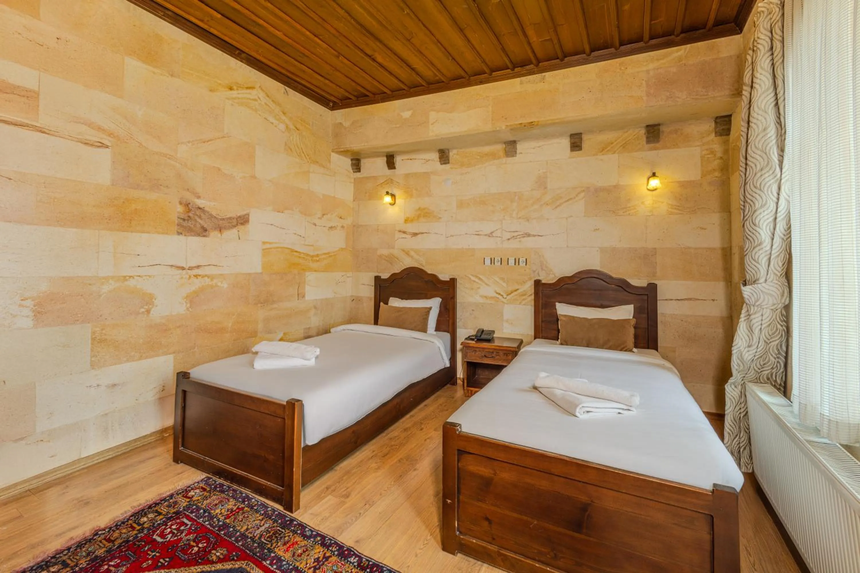 Bed in Akuzun Stone Hotel