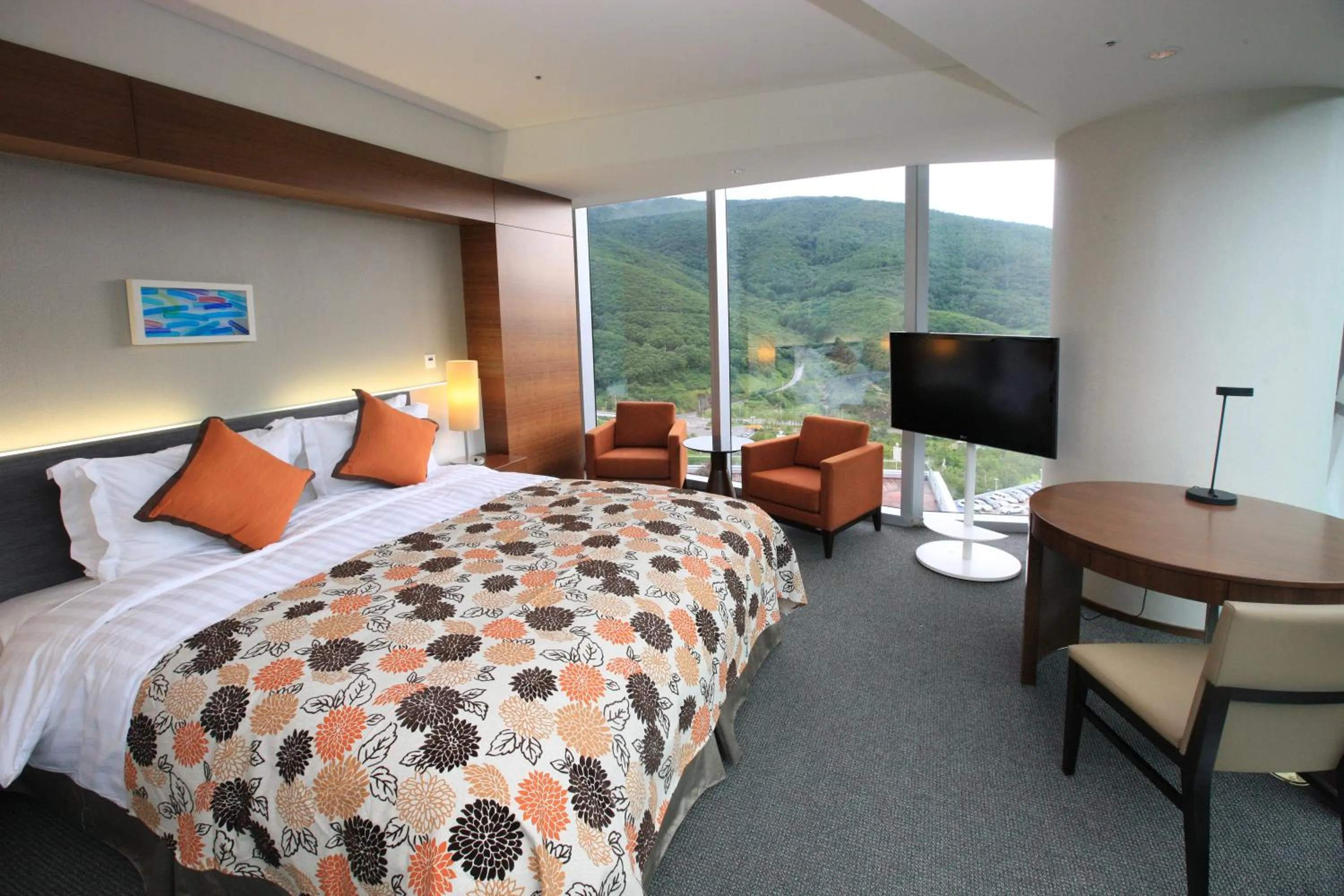 Bed in High1 Grand Hotel Convention Tower