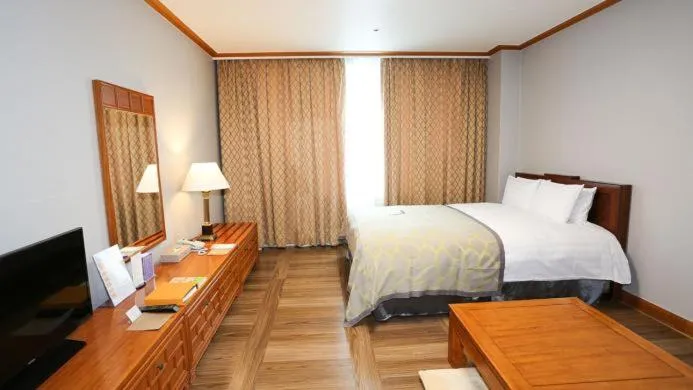 Bed in High1 Palace Hotel and CC