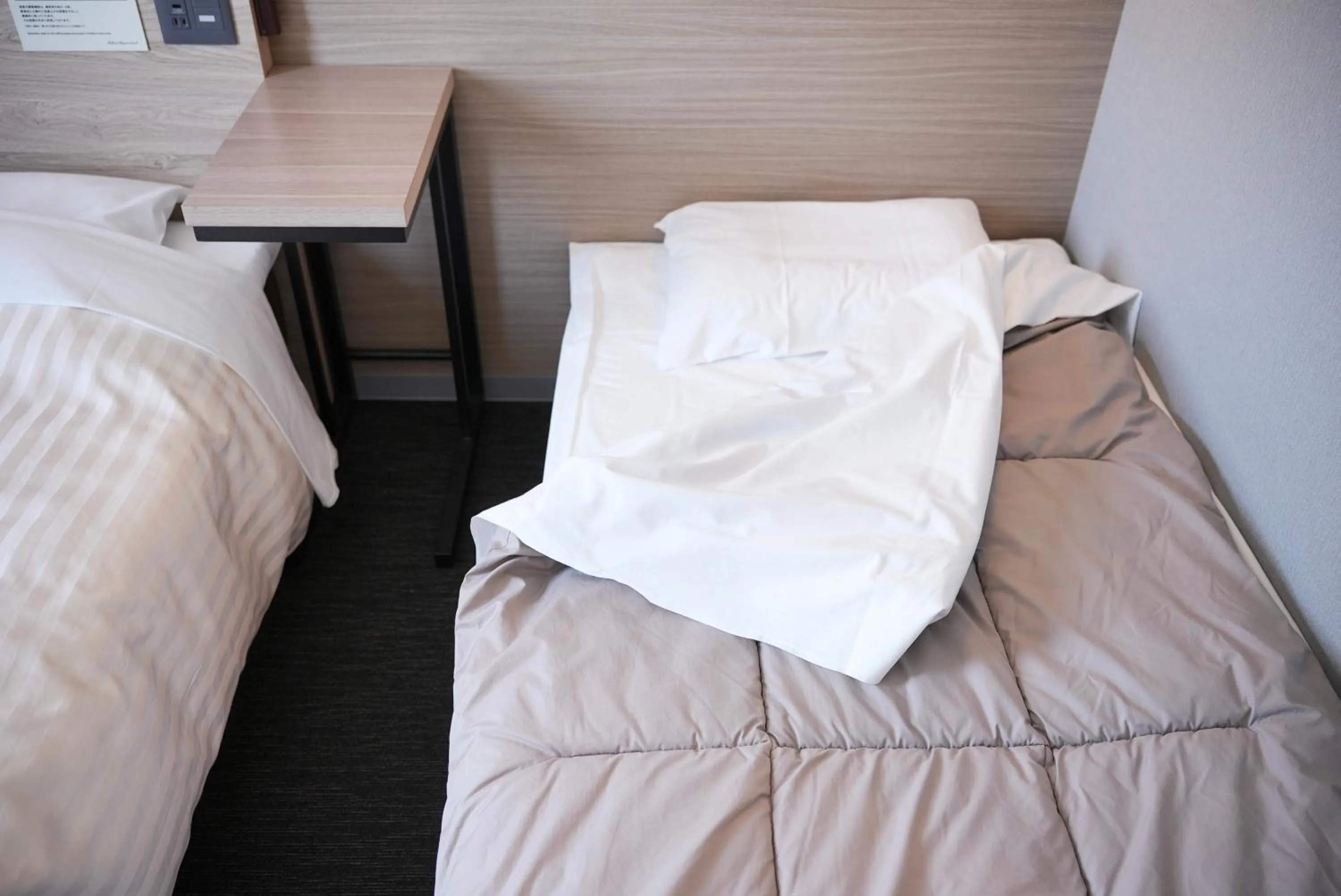 Bed in Super Hotel Shikoku-chuo