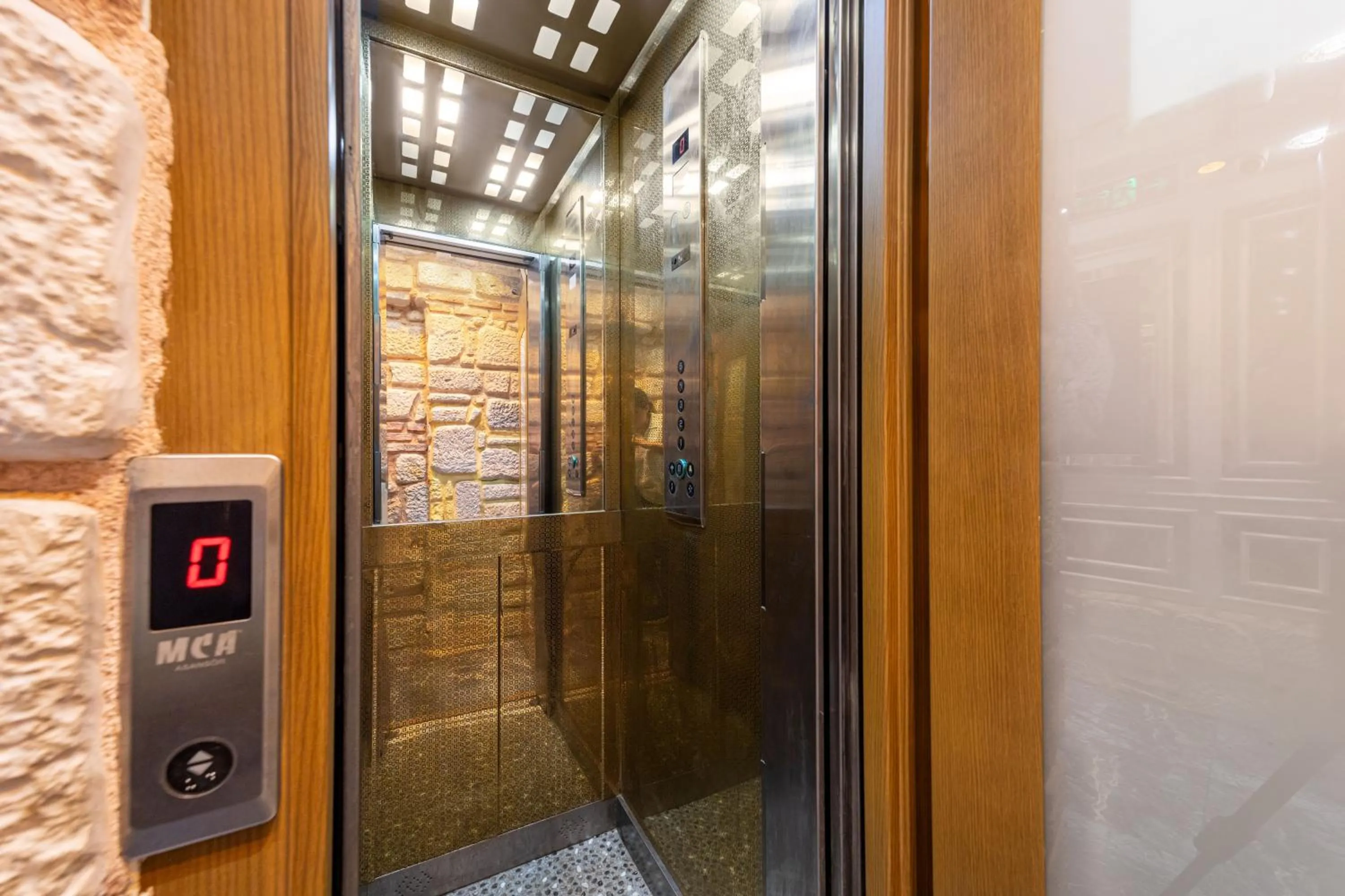 elevator in REN PLUS SUITES