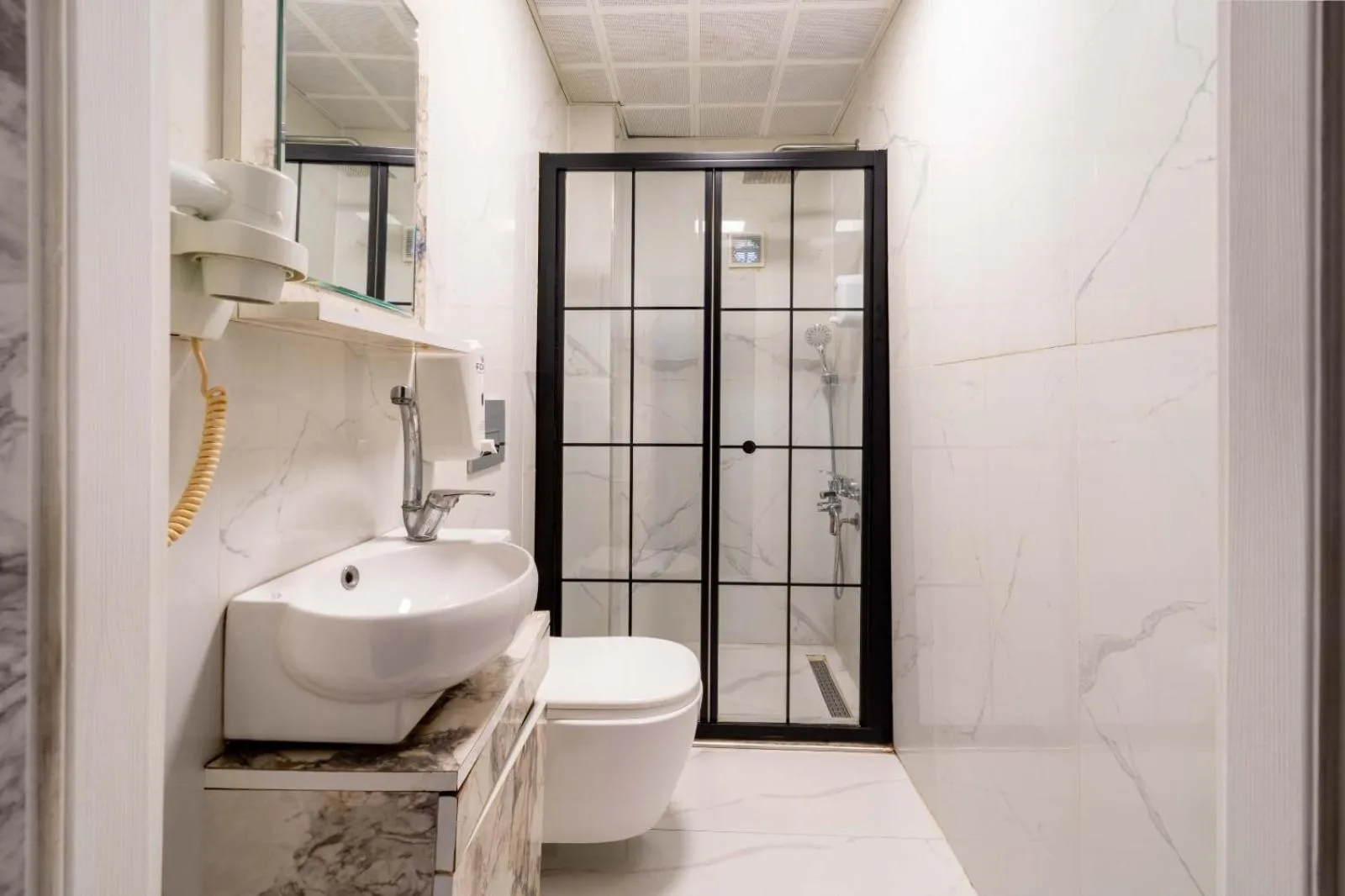 Shower in REN PLUS SUITES