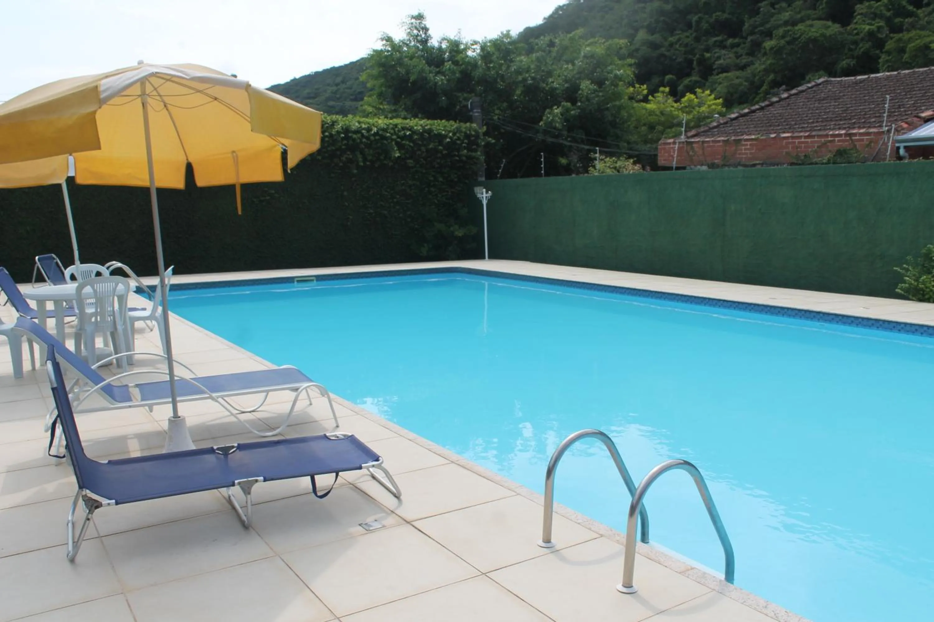 Swimming pool in Pousada Porto Paraiso, o seu Paraíso Escondido no Guarujá