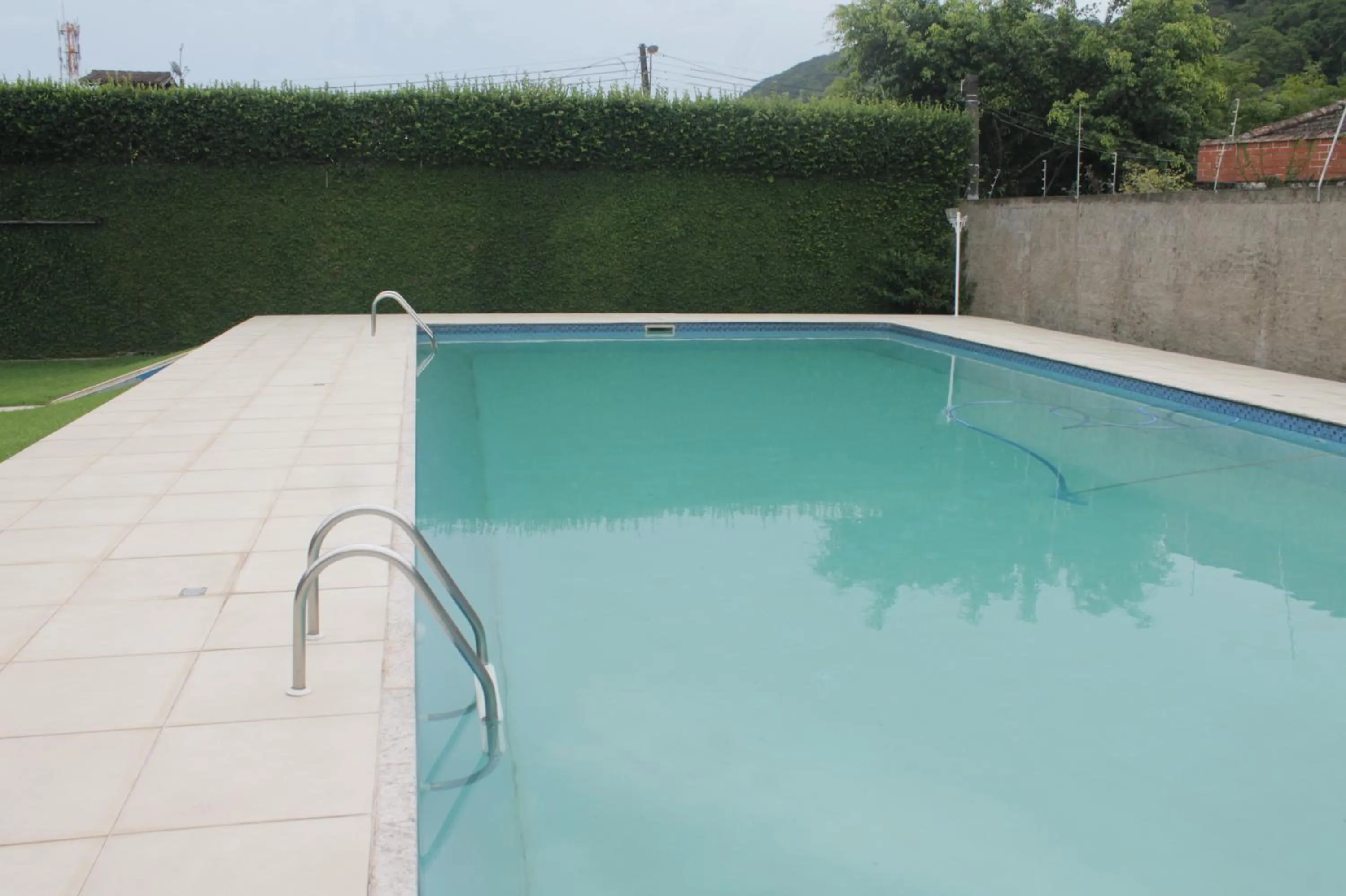 Swimming pool in Pousada Porto Paraiso, o seu Paraíso Escondido no Guarujá