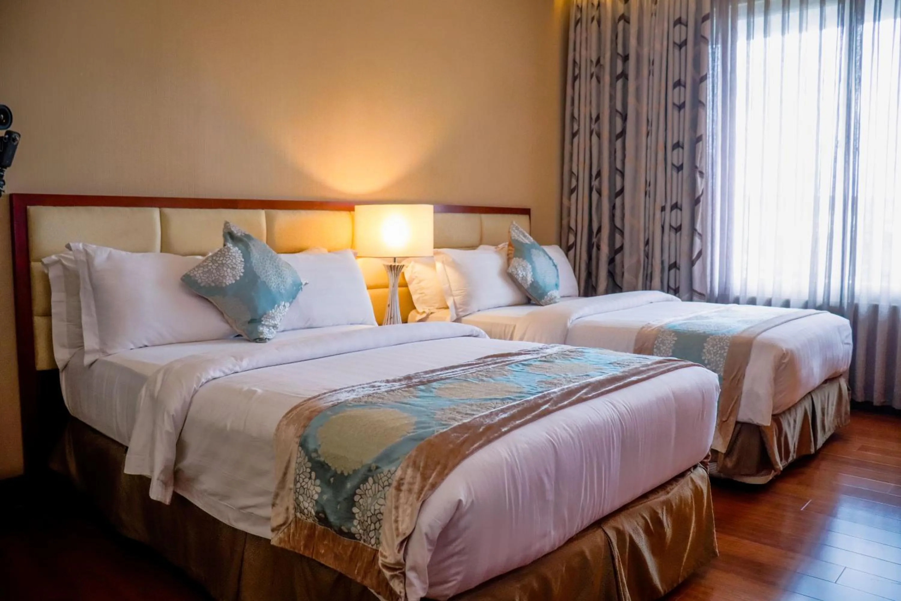 Bed in The Avenue Plaza Hotel