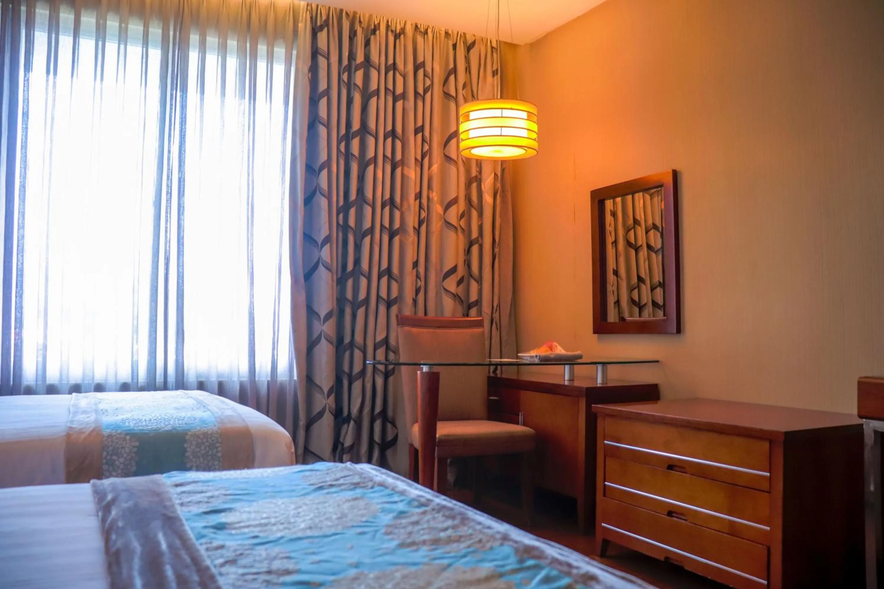 Bed in The Avenue Plaza Hotel