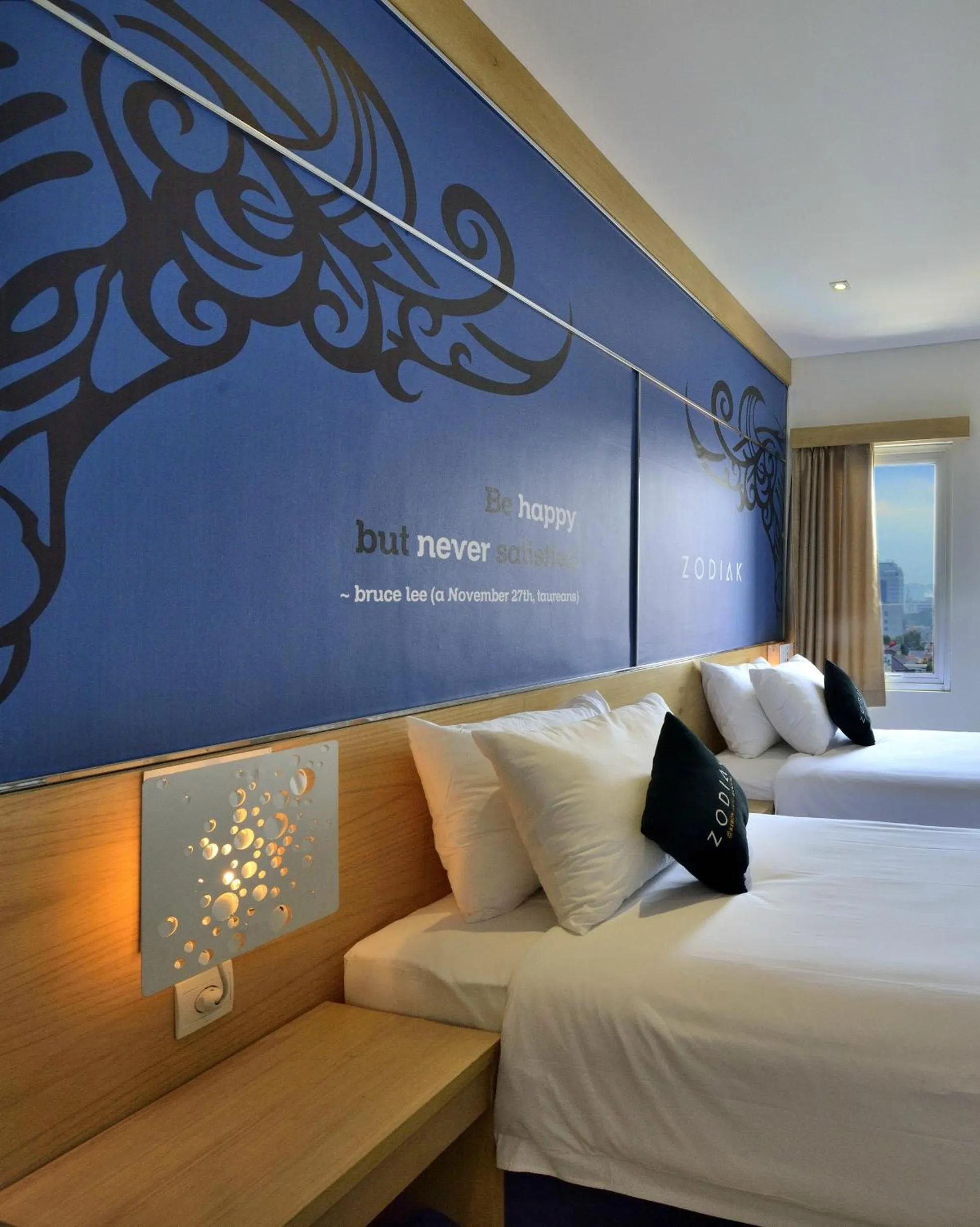 Bed in Zodiak at Kebon Jati Hotel