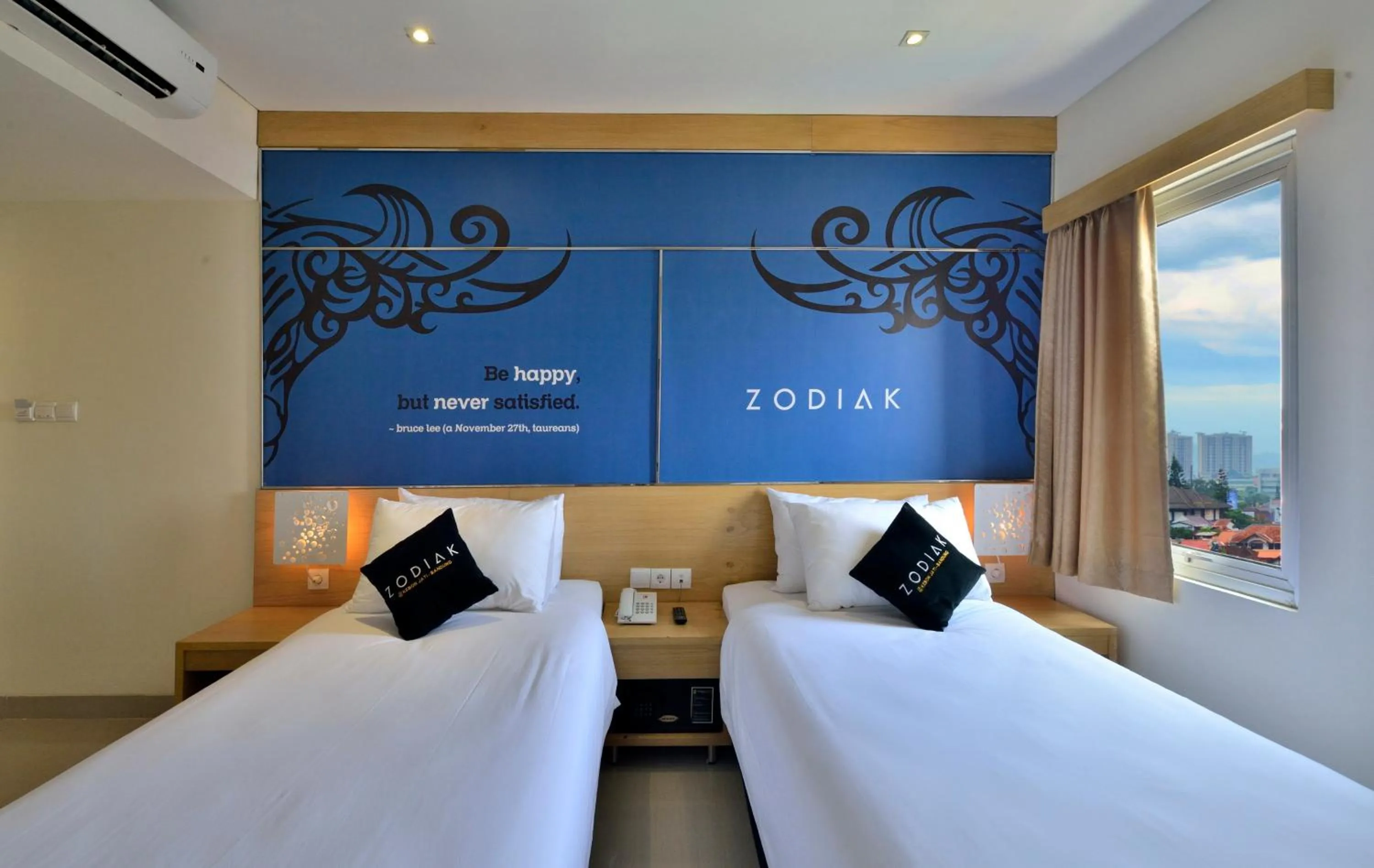 Bed in Zodiak at Kebon Jati Hotel