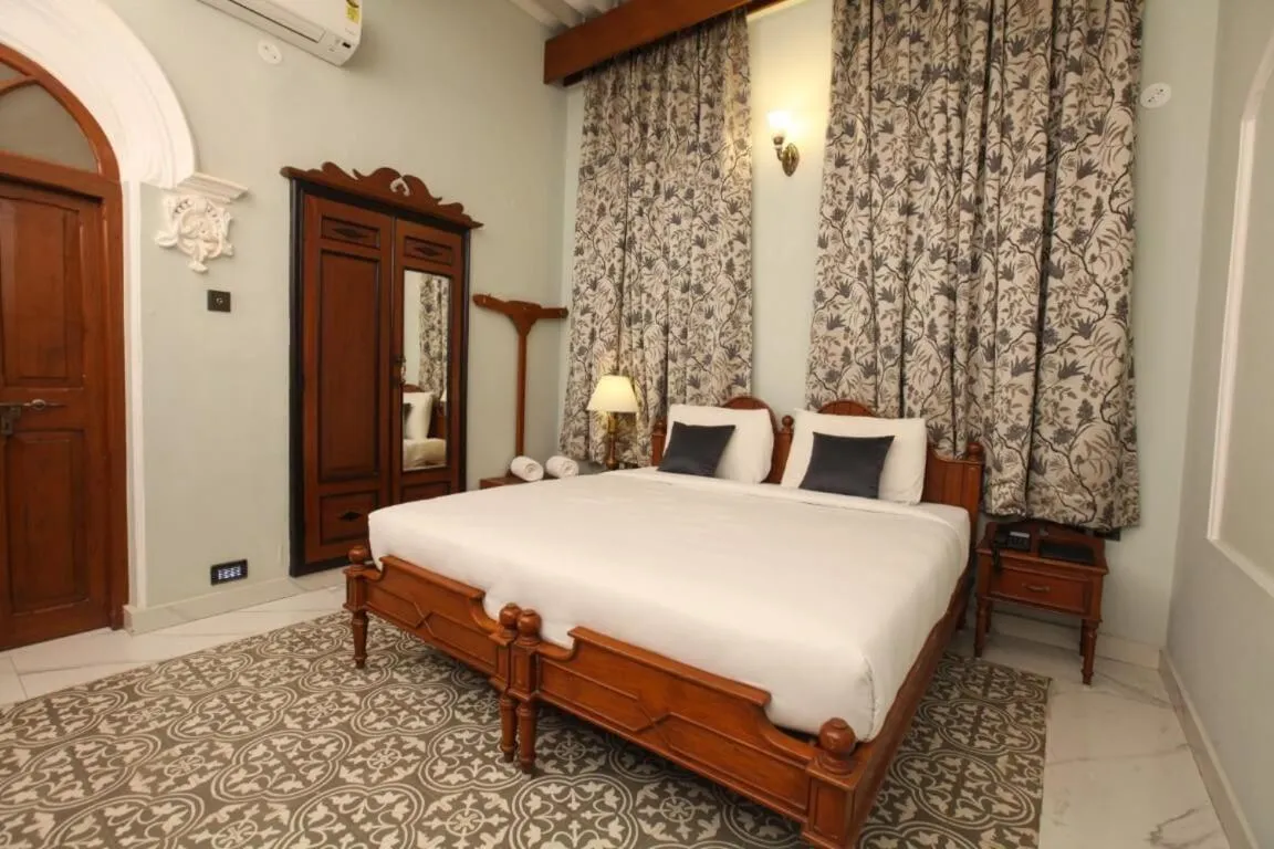 Bed in Taj Mahal Hotel Abids
