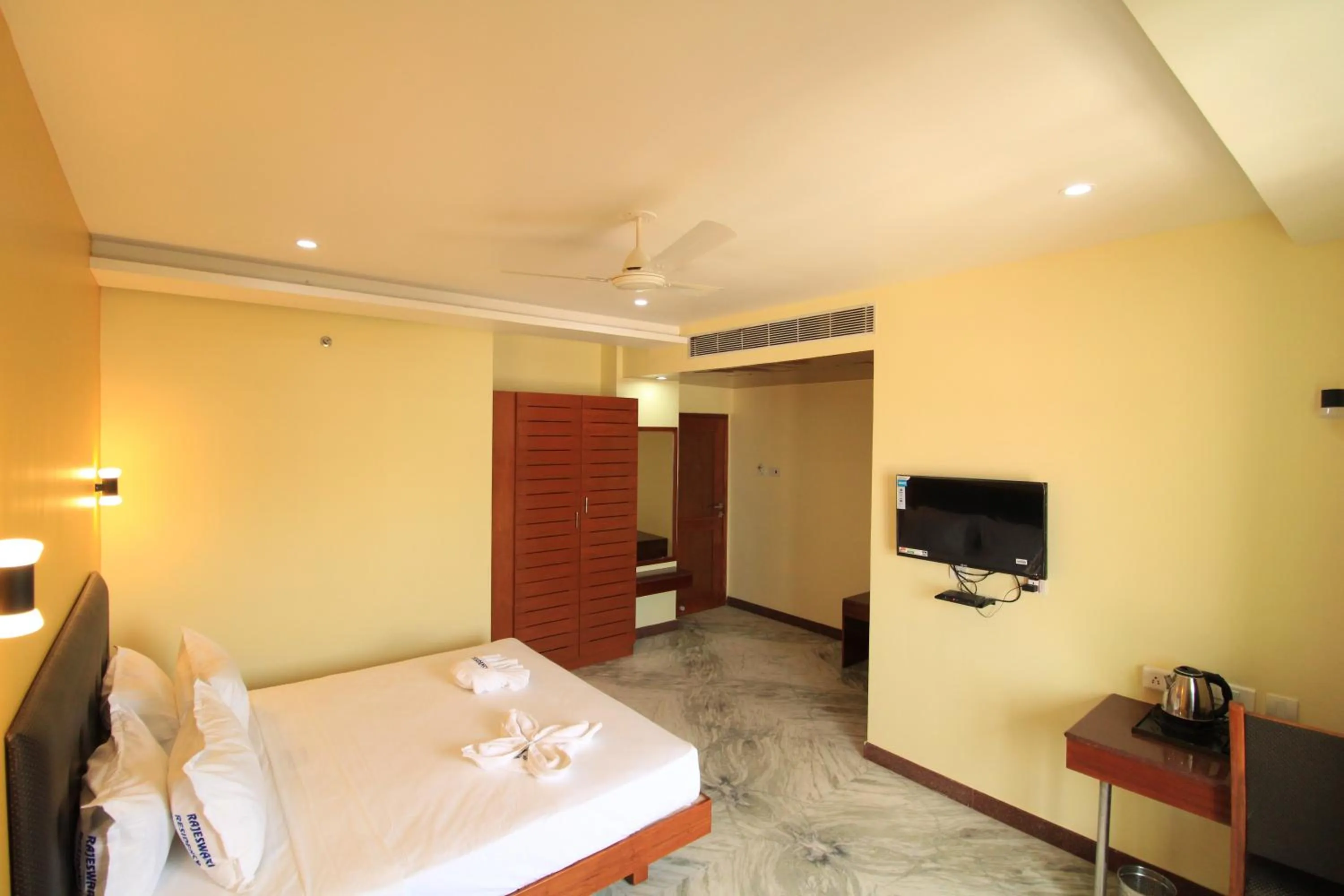 Photo of the whole room, Bed in Pondy Southern Residency