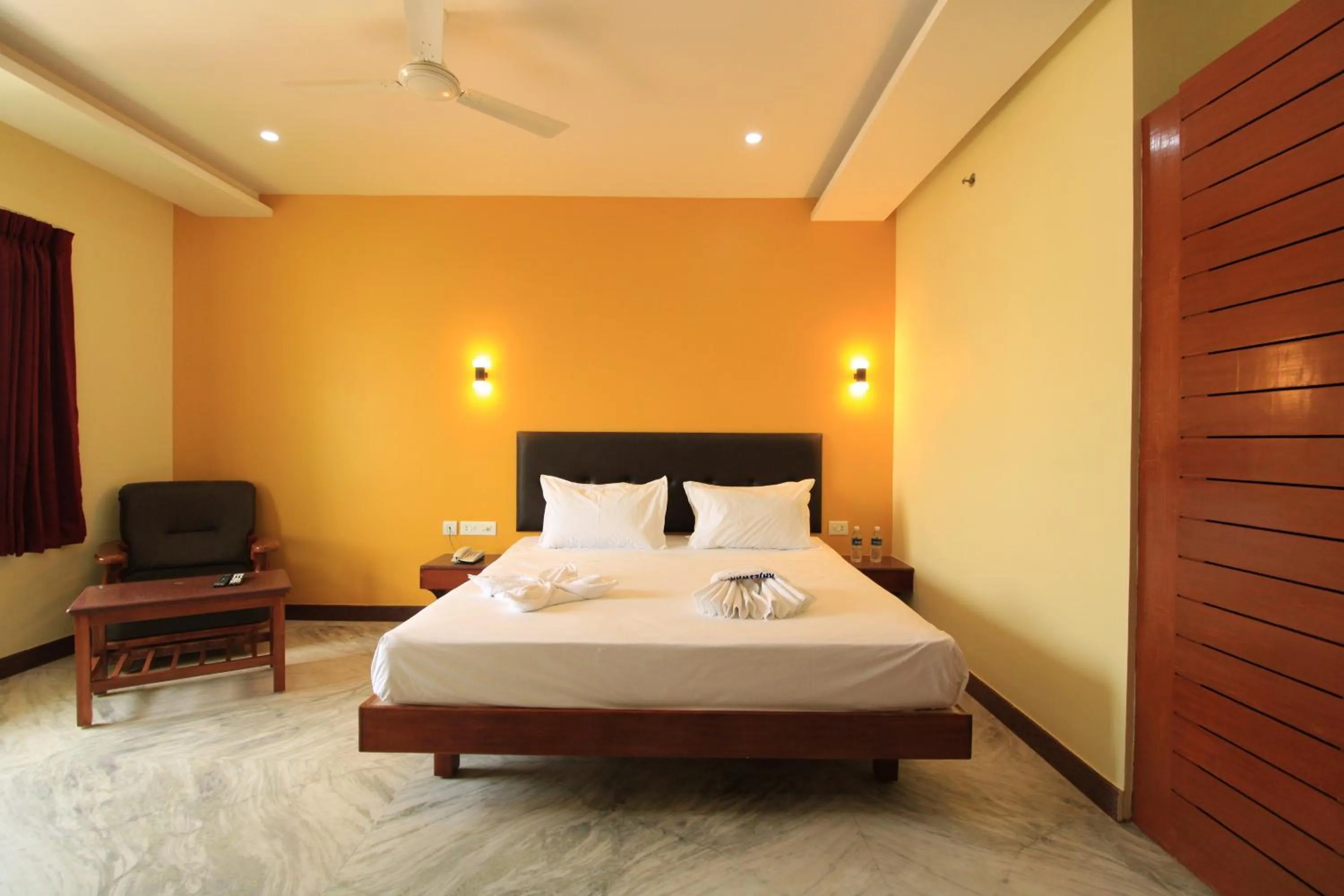 Photo of the whole room, Bed in Pondy Southern Residency