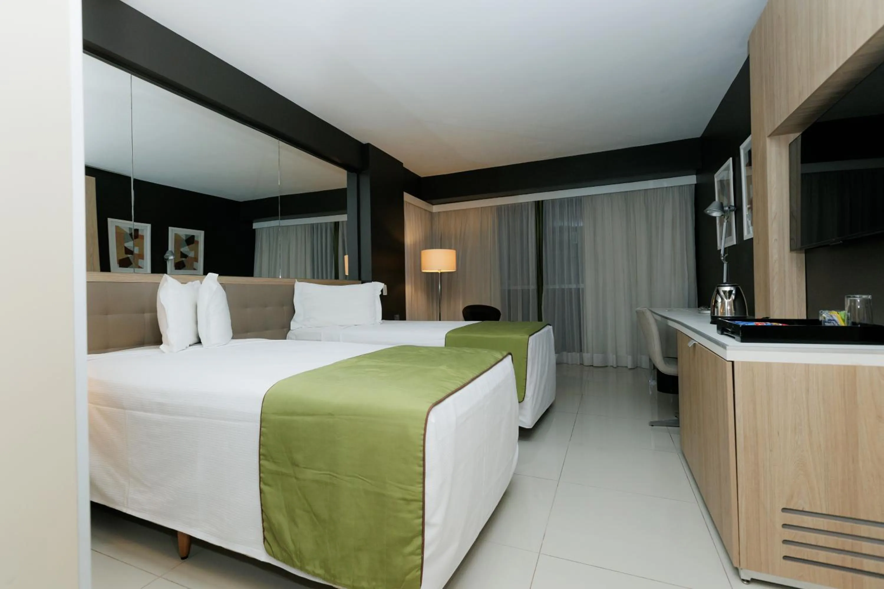 Bed in eSuites Savassi Toscanini