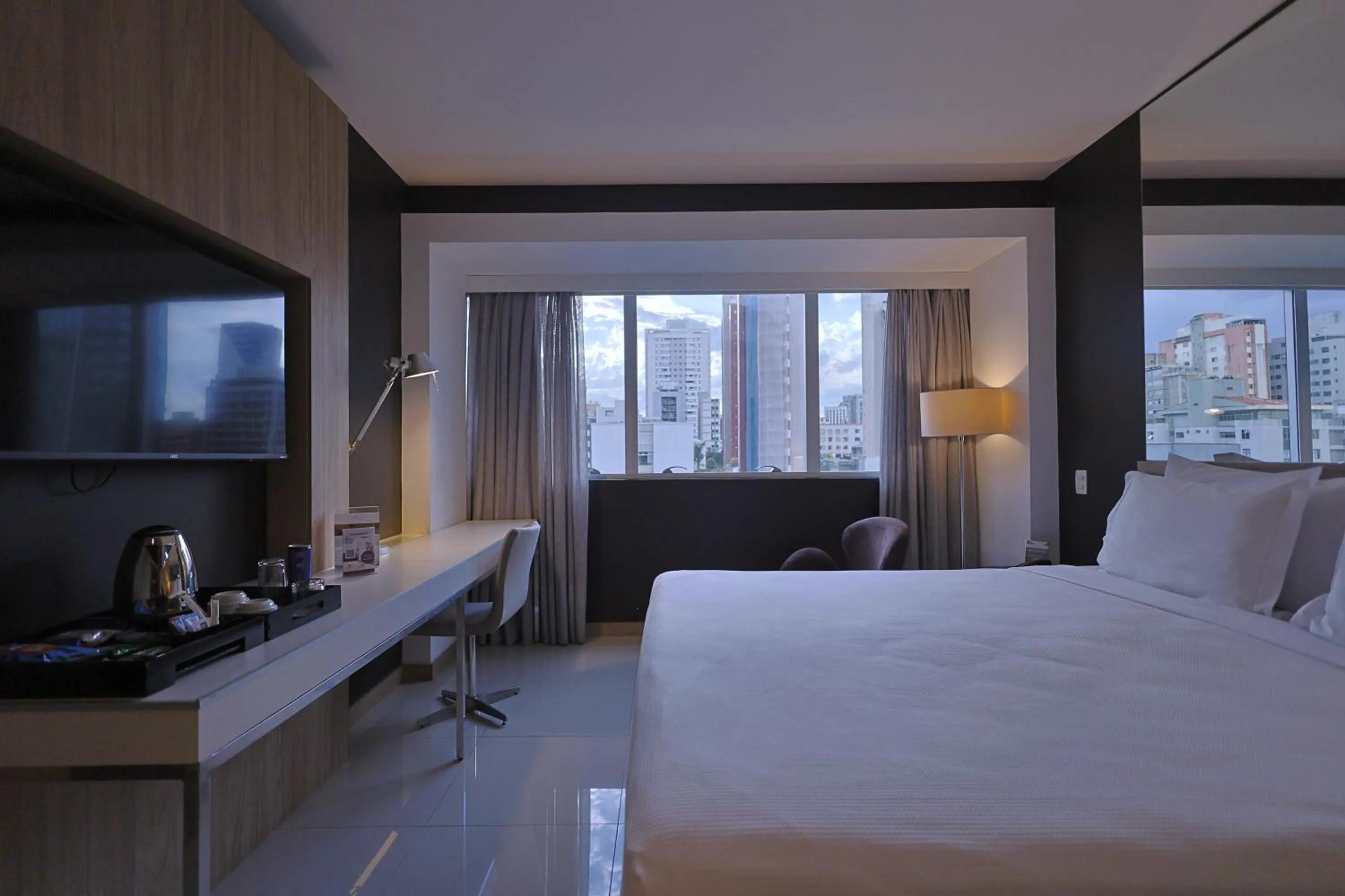 Bed in eSuites Savassi Toscanini