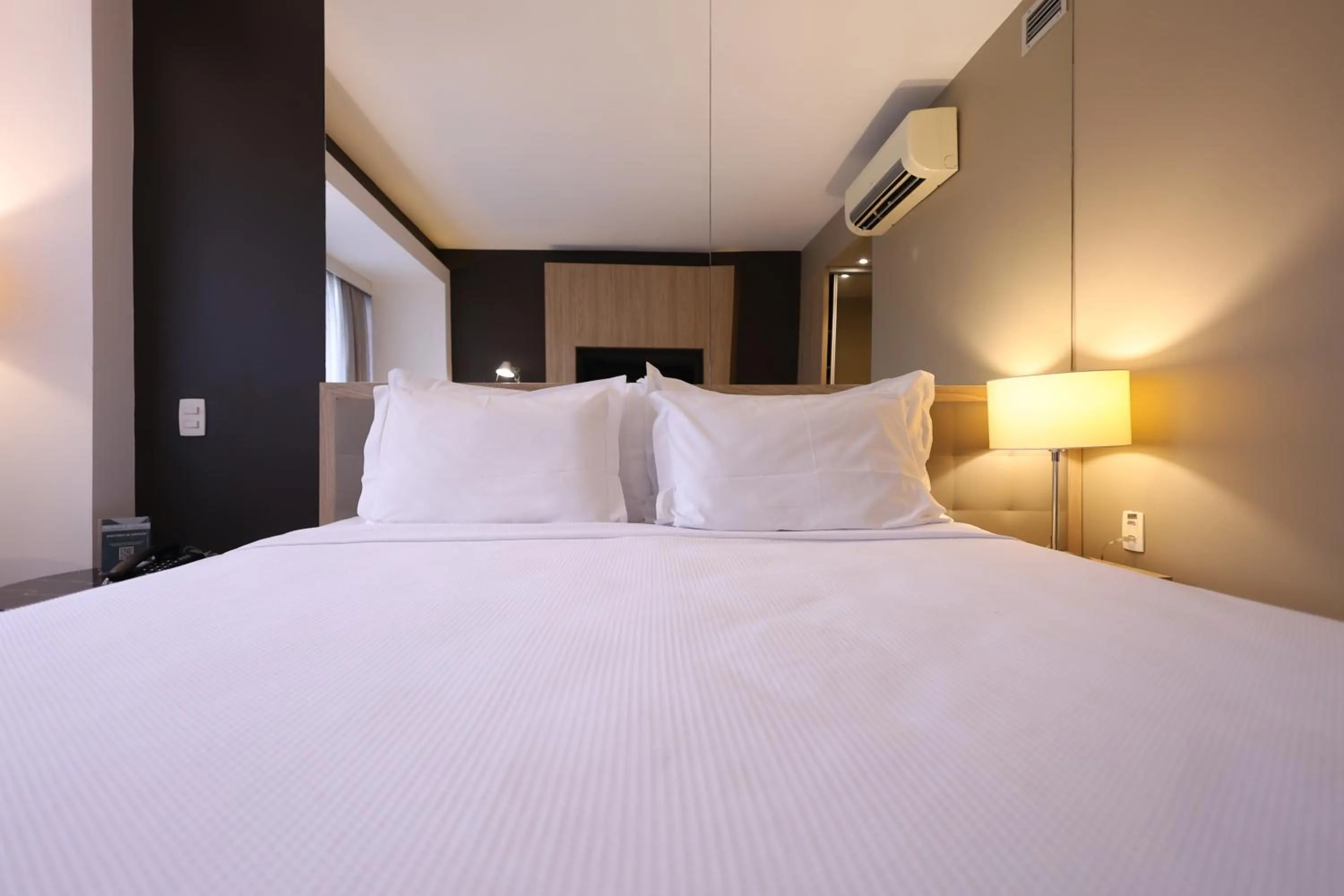 Bed in eSuites Savassi Toscanini