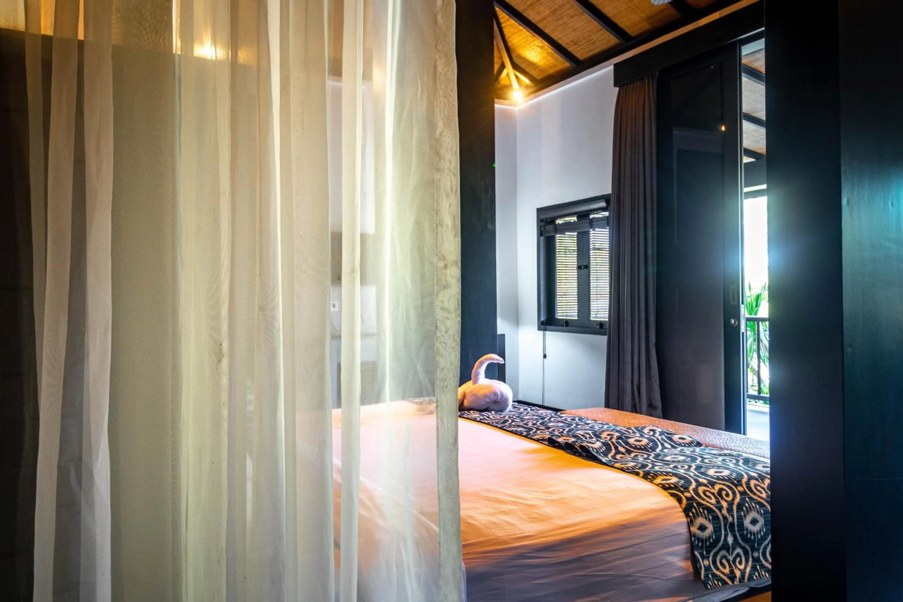 Bed in Surya Melasti Beach Villa