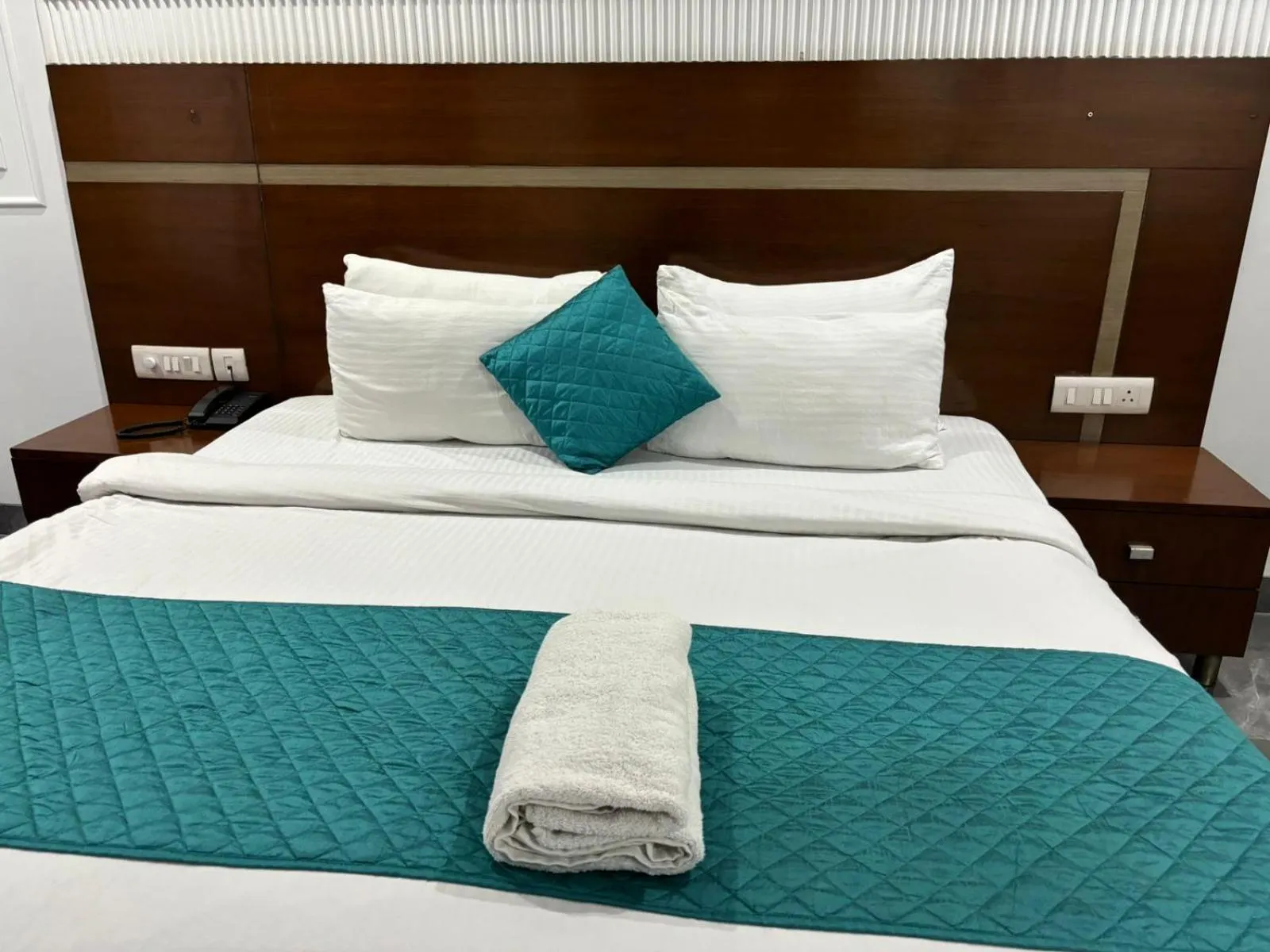 Bed in Asian Suites IFFCO Metro Station Gurugram