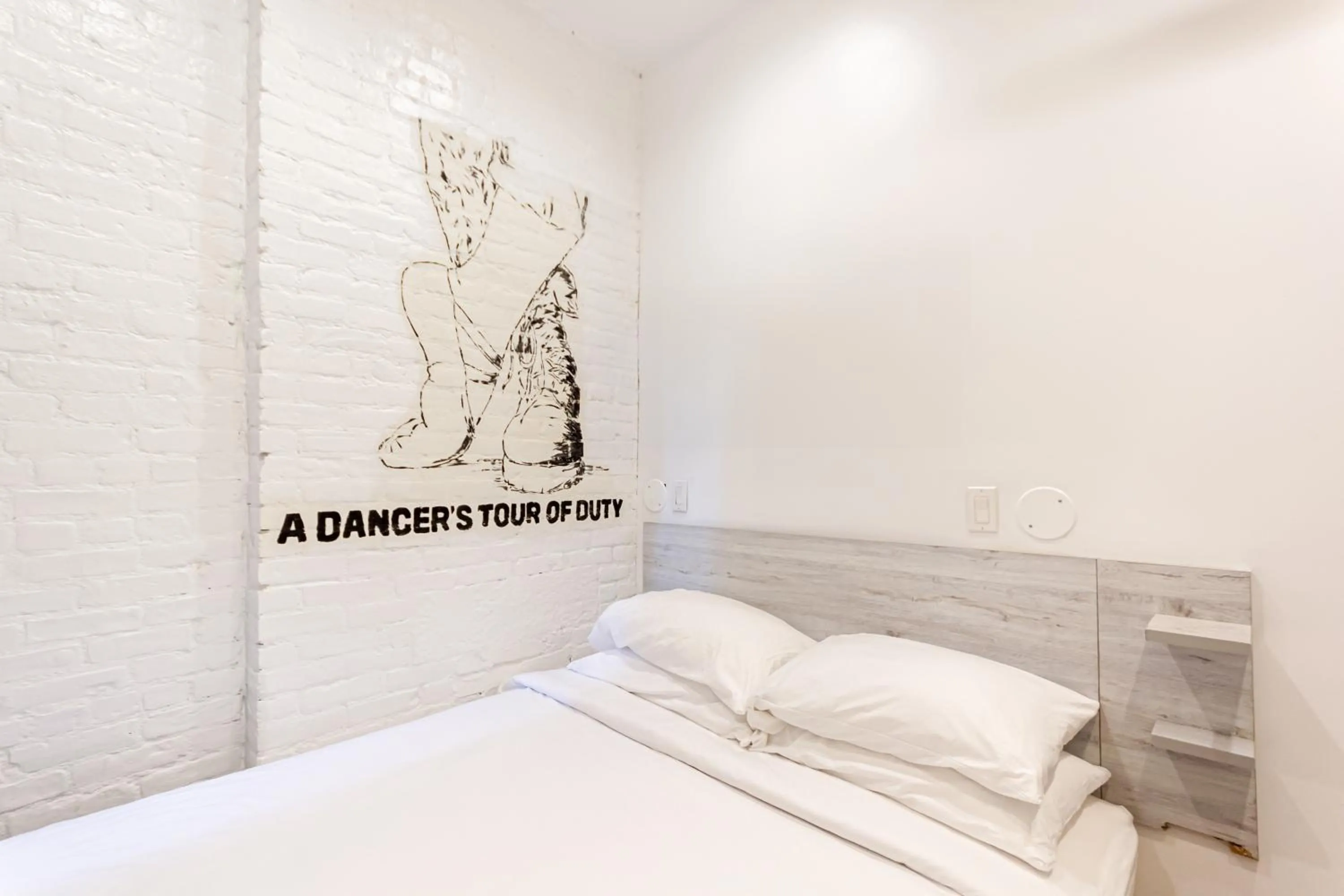 Bed in JG Times SQ Hotel by JGSTAY