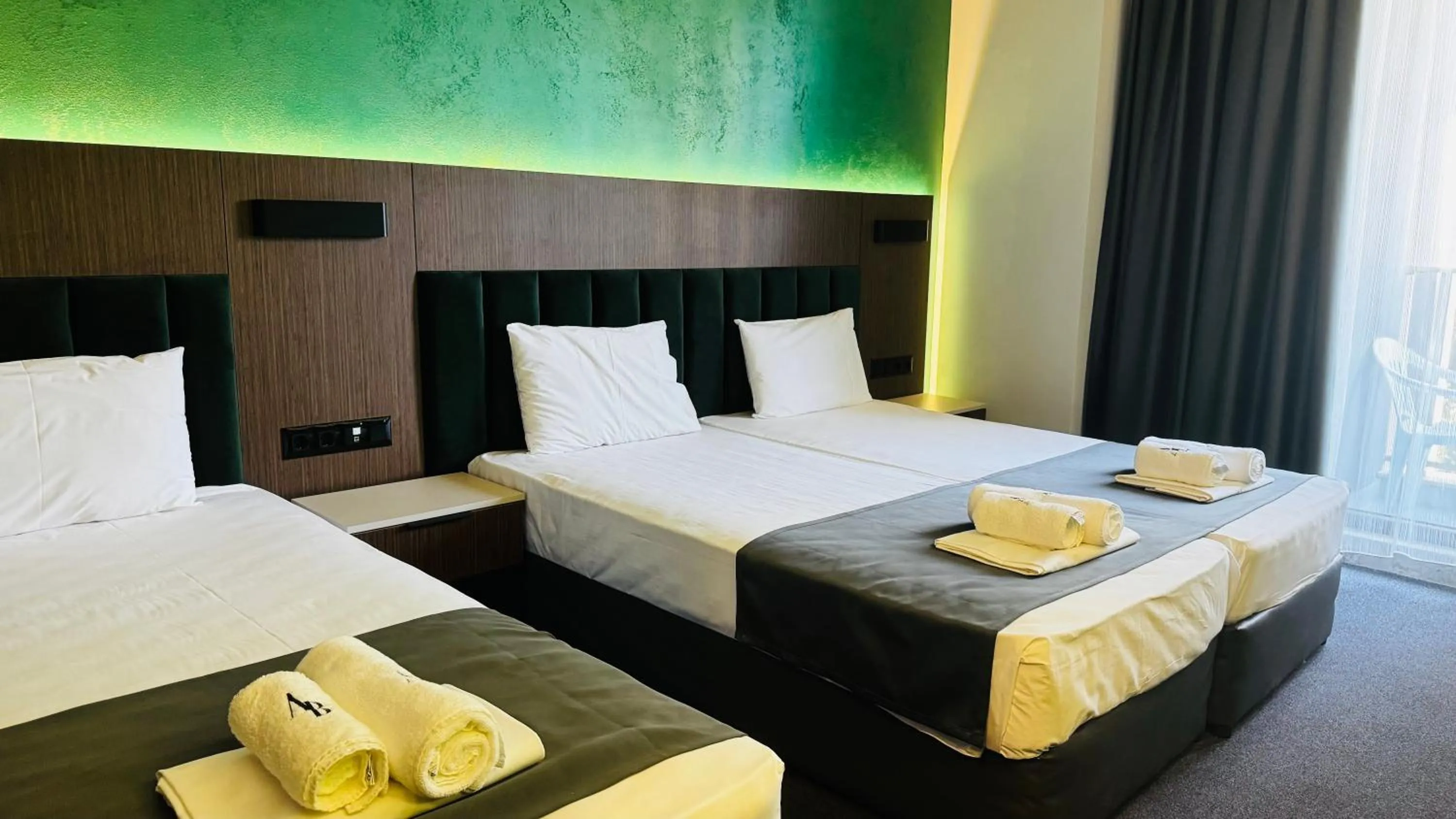 Bed in Atliman Beach Park Hotel