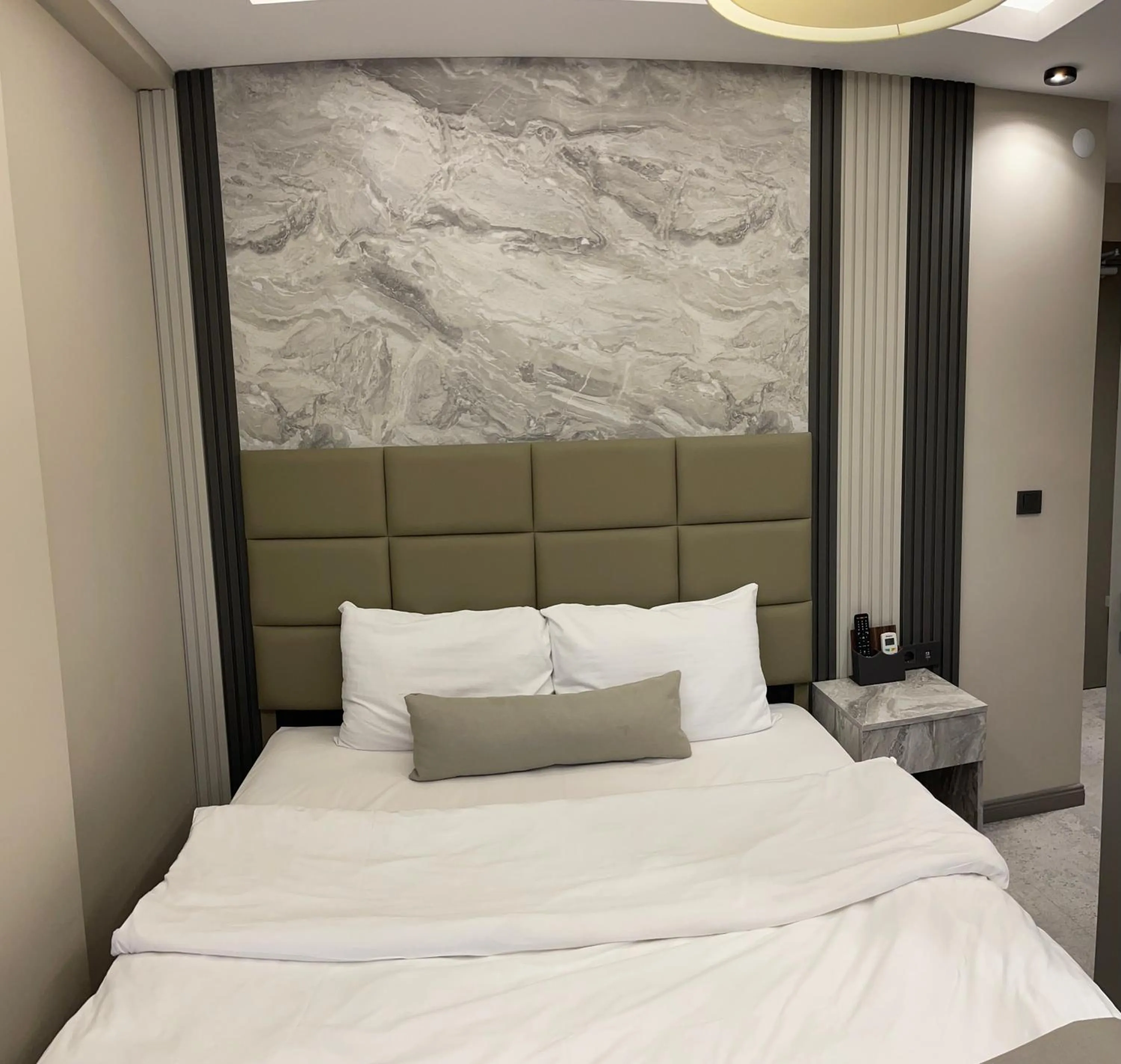 Bed in Aymira Suite Hotel