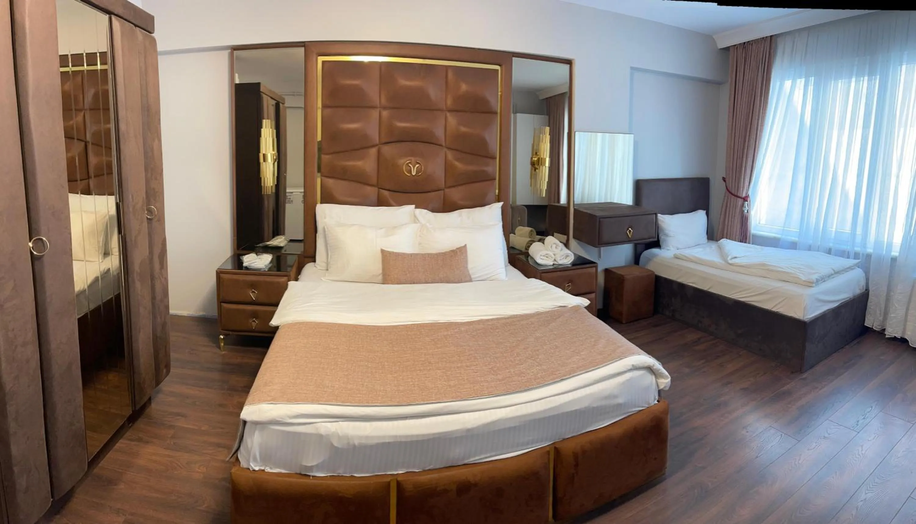 Bed in Aymira Suite Hotel