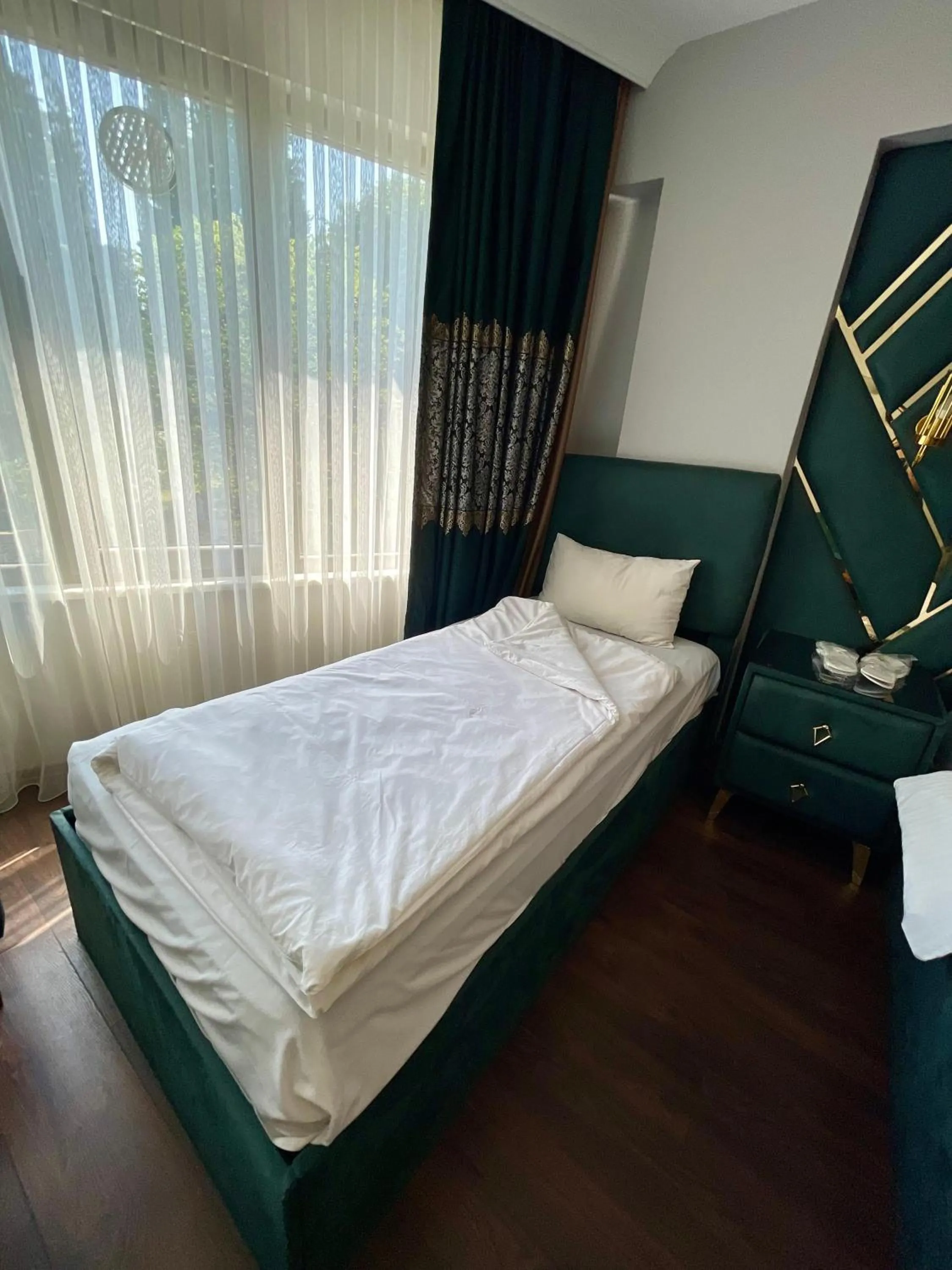 Bed in Aymira Suite Hotel