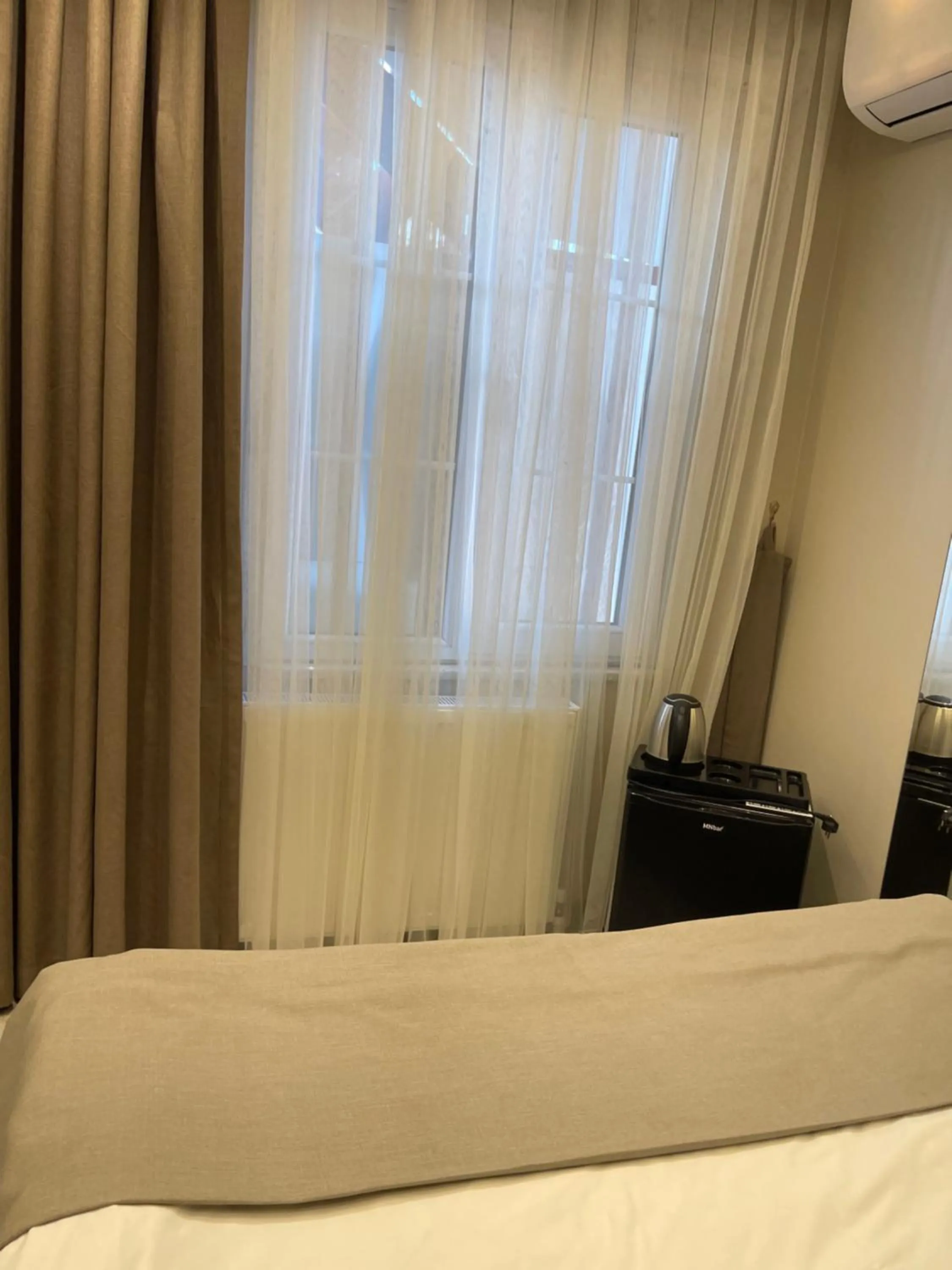 Bed in Aymira Suite Hotel