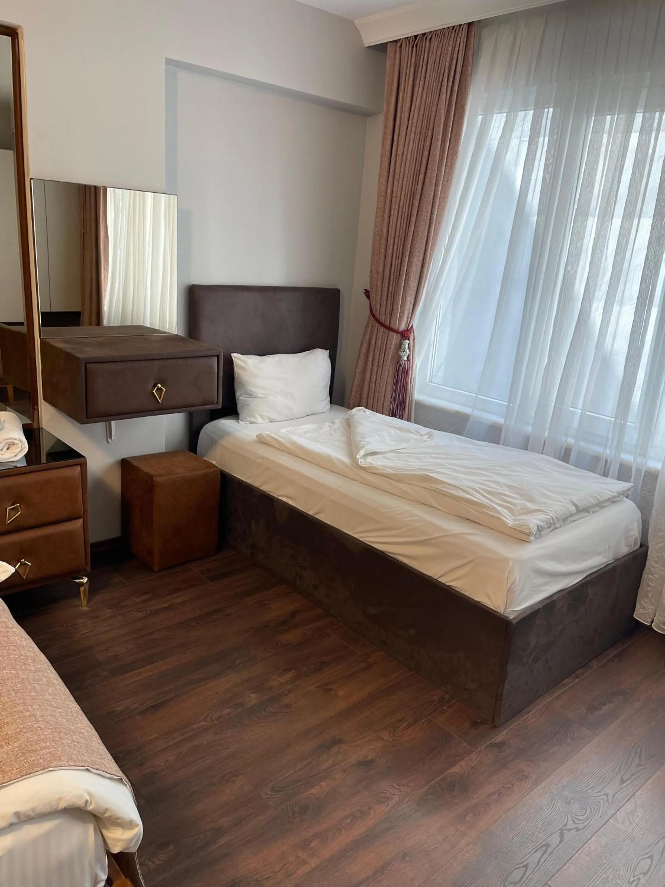 Bed in Aymira Suite Hotel