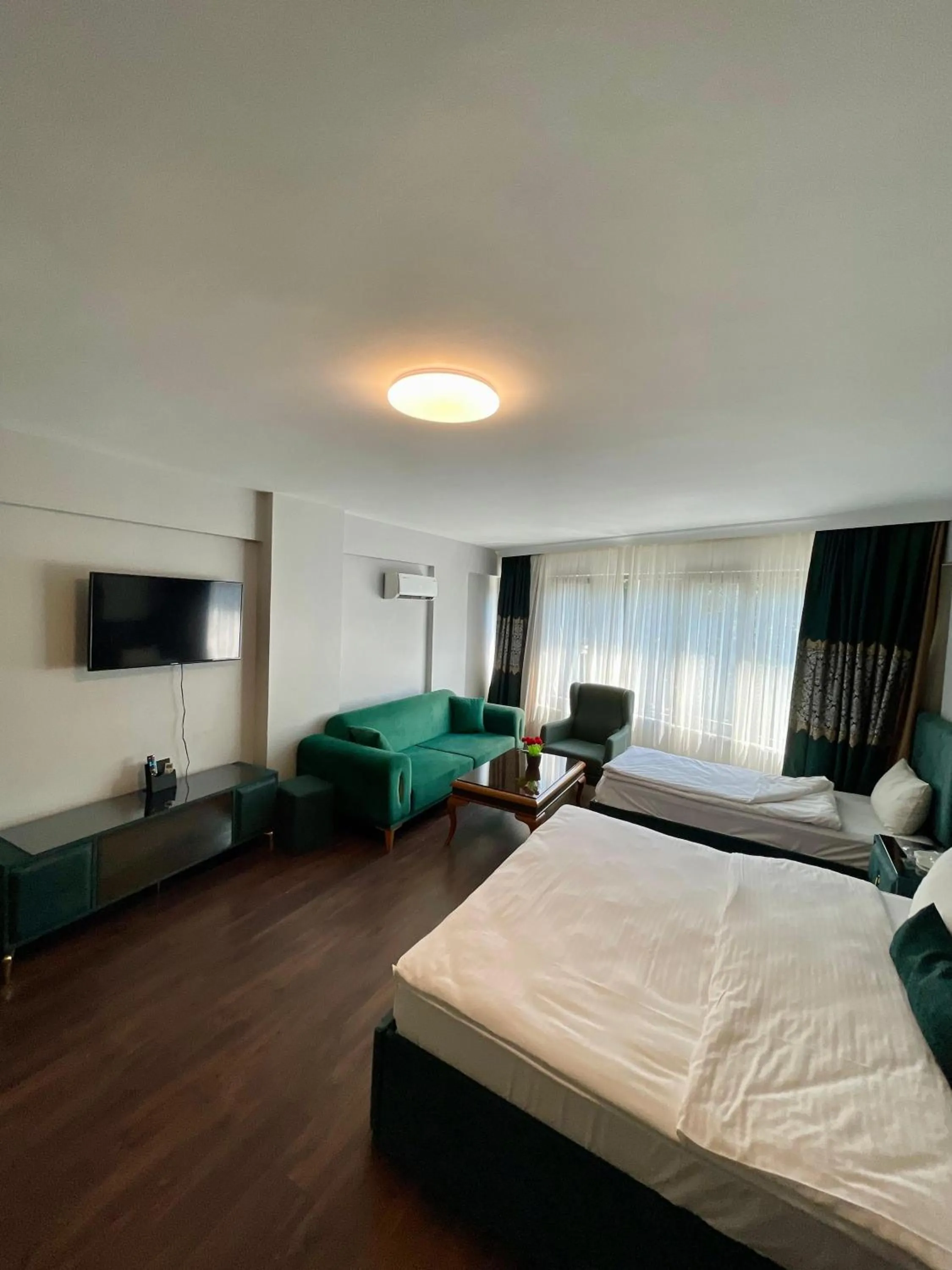 Bed in Aymira Suite Hotel