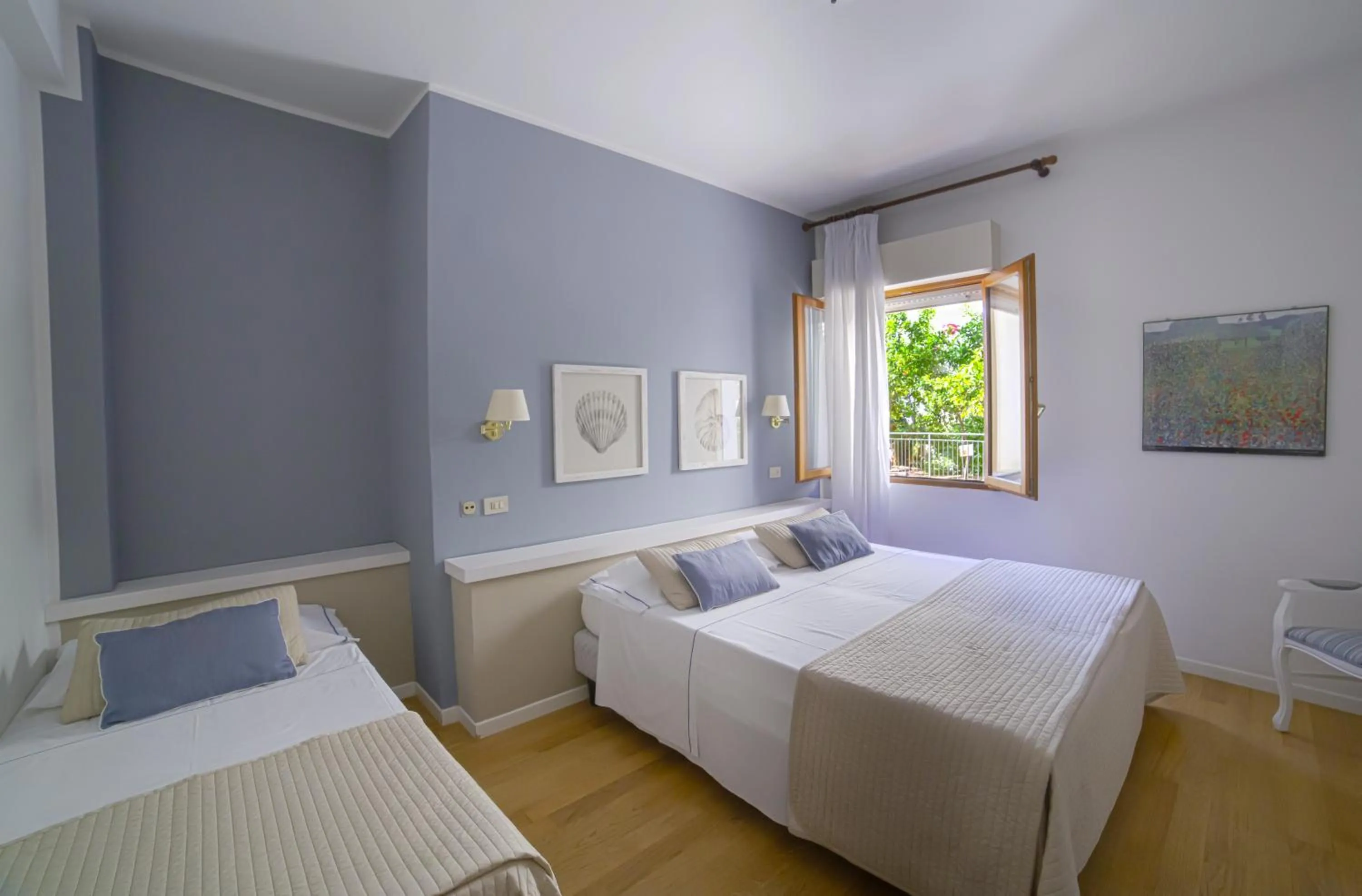 Bed in Hotel Punta Nord Est