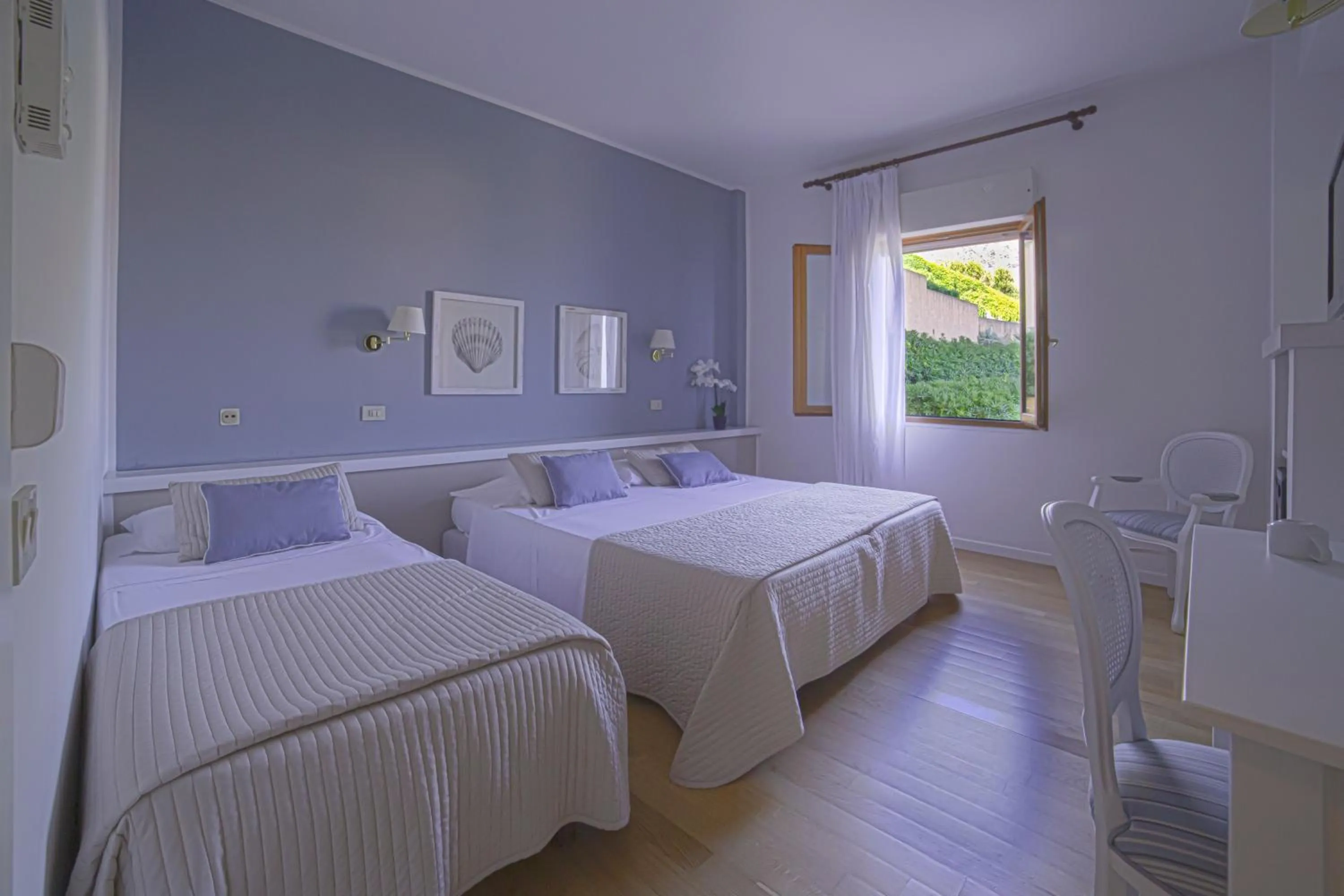 Bed in Hotel Punta Nord Est