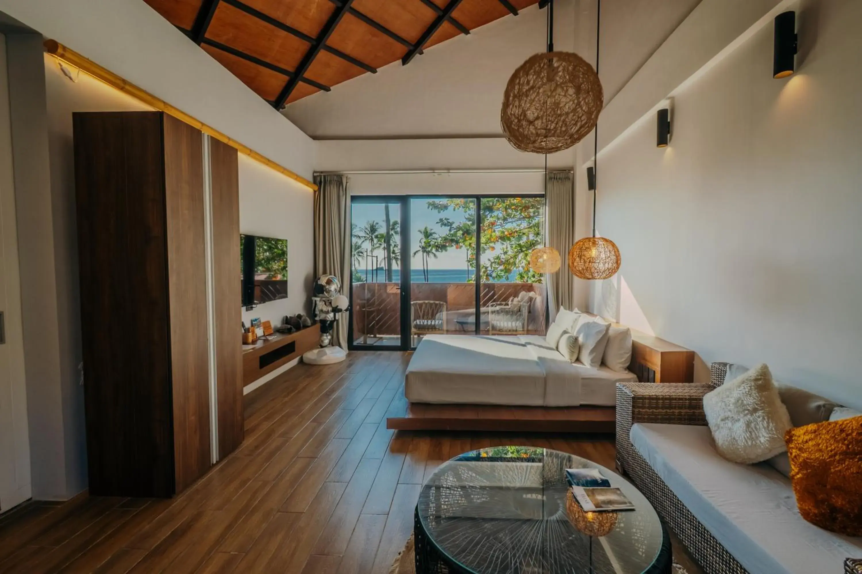 Deluxe King Bed with Balcony and Ocean View in Nacpan Beach Resort Managed by H Hospitality Group Deluxe King Bed with Balcony and Ocean View in Nacpan Beach Resort Managed by H Hospitality Group