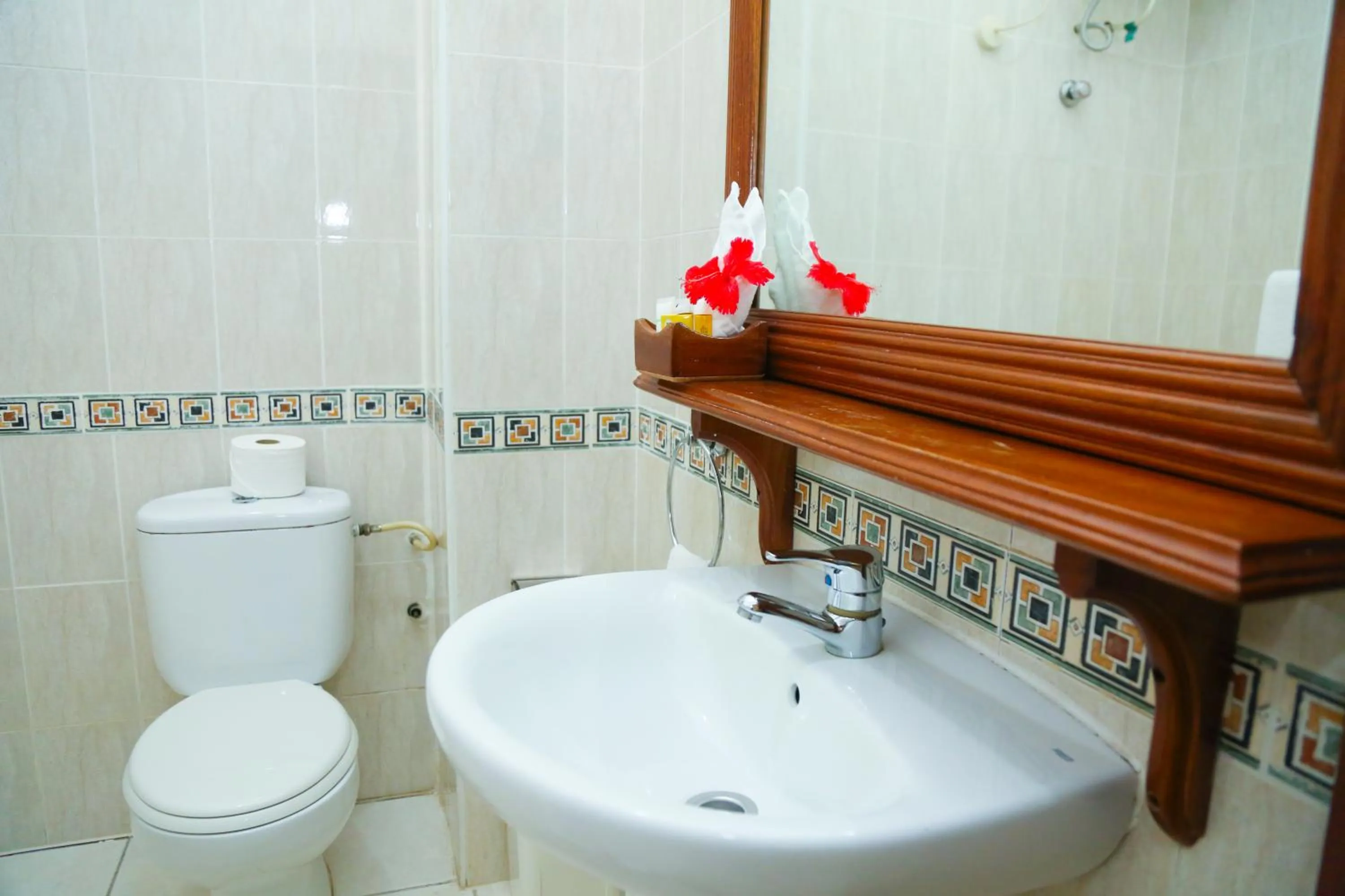 Bathroom in Coconut Grove Regency Hotel