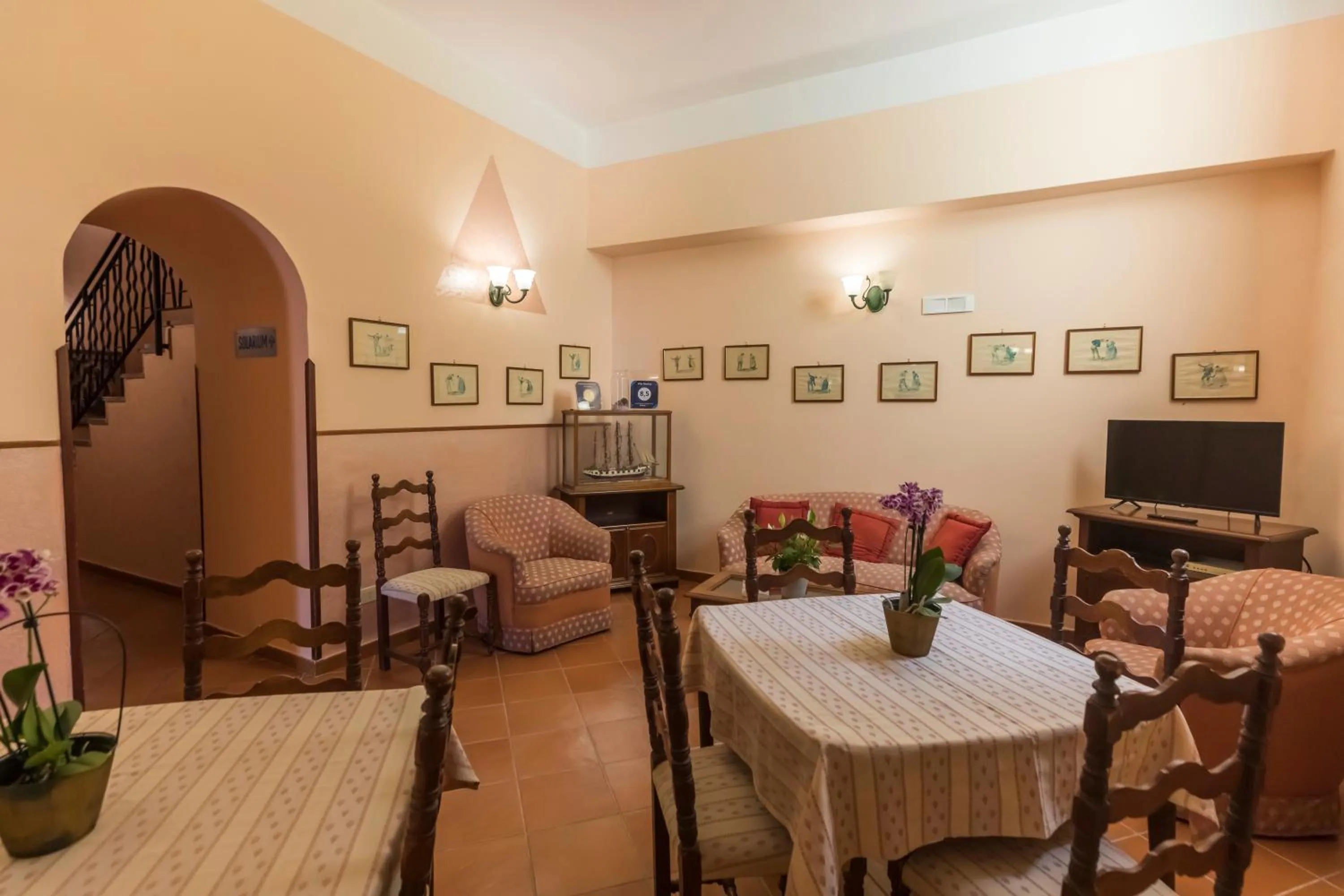 Communal lounge/ TV room in Villa Romita