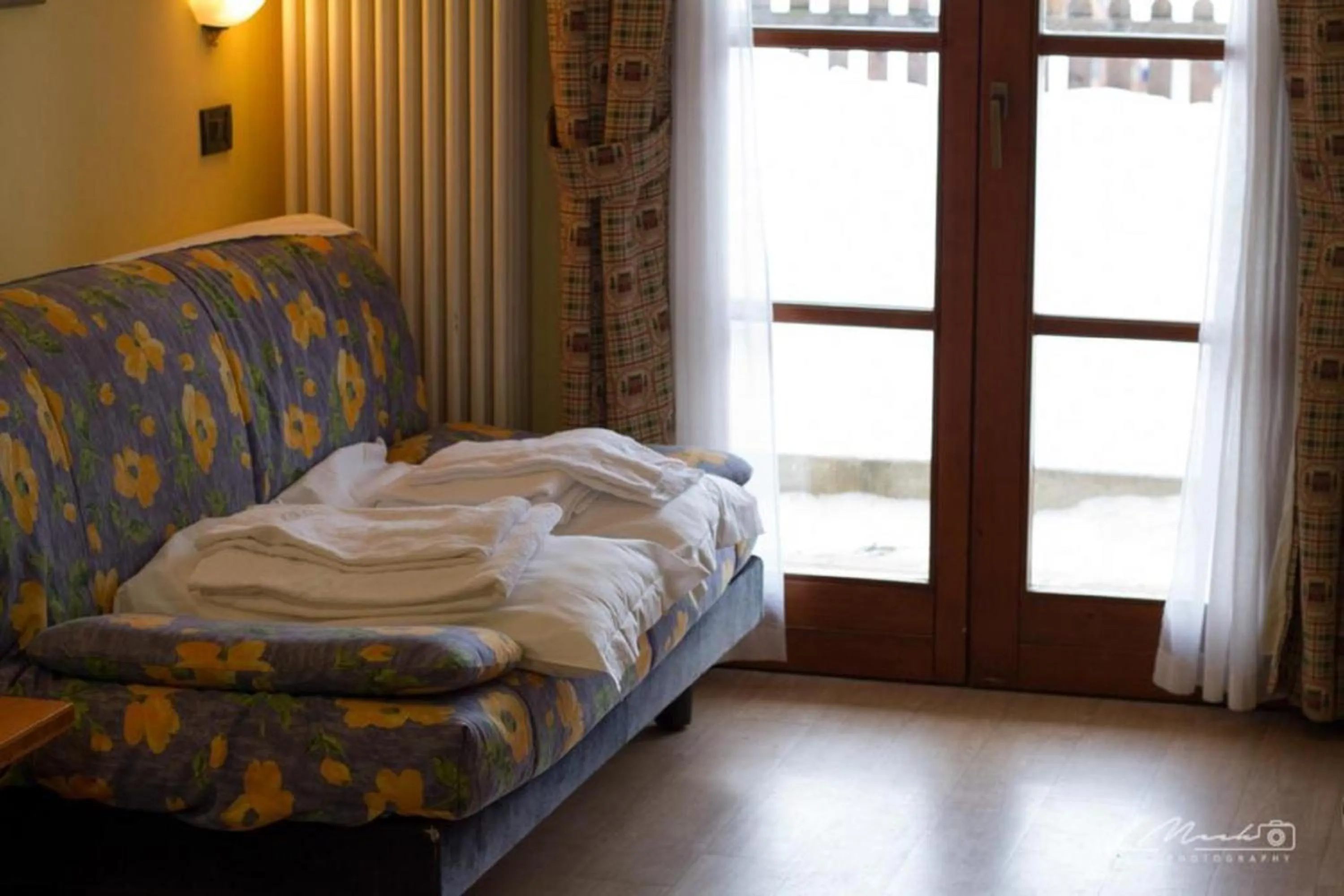 Seating area, Bed in Nevesole Folgarida Resort Aparthotel