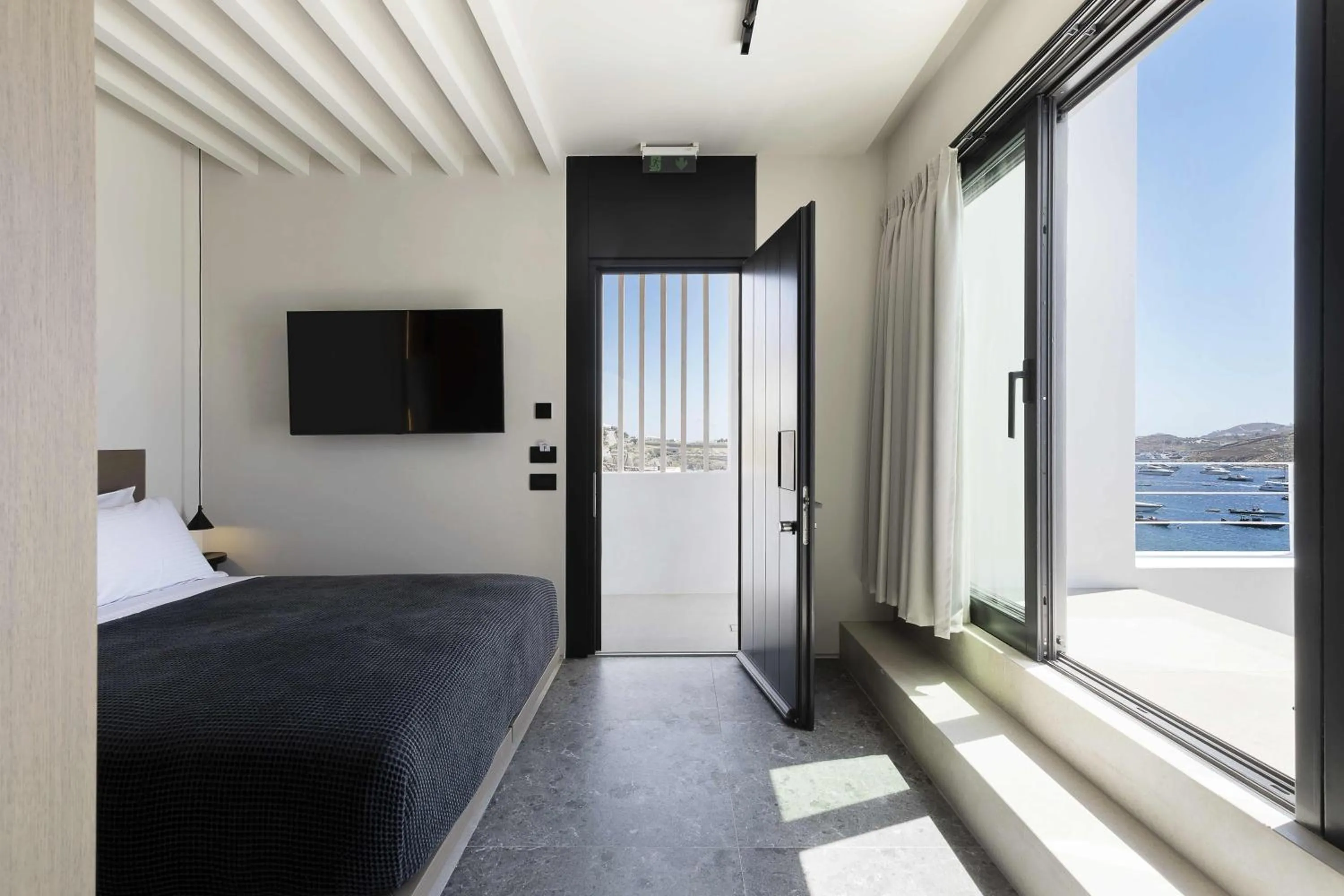 Bed in CUBIC Mykonos Seafront Design Suites