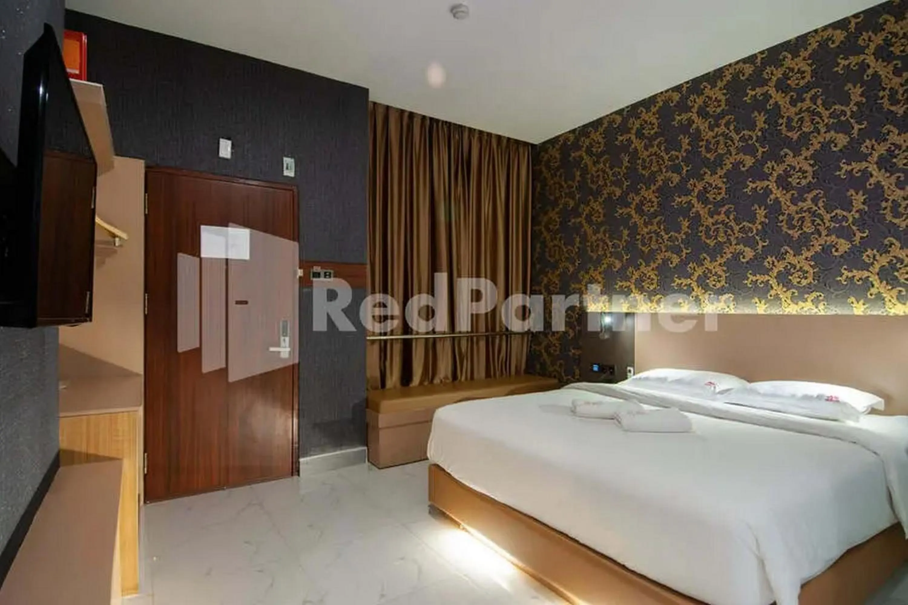 Bedroom, Bed in Selecta Hotel Medan Petisah R Signature Mitra RedDoorz