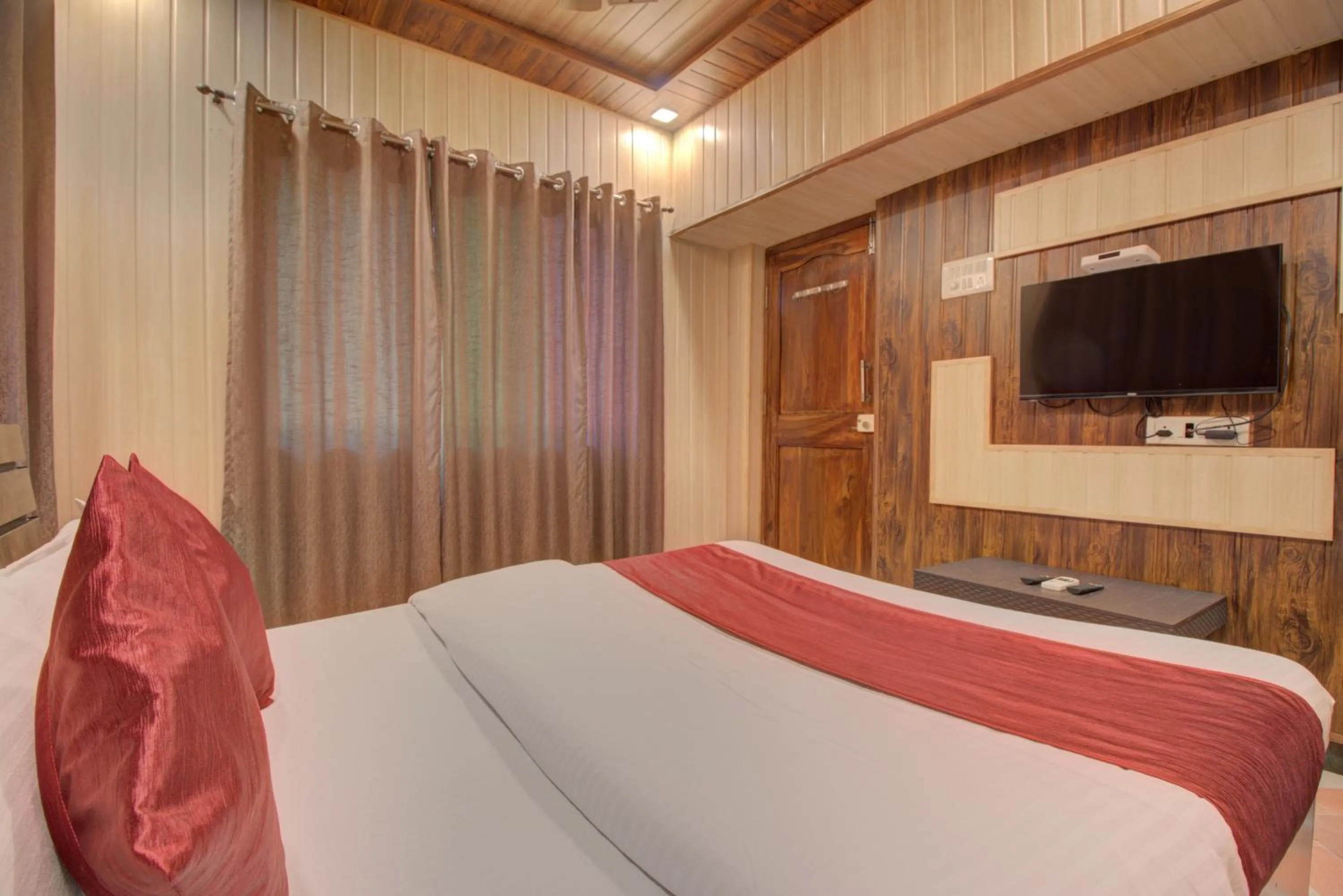TV and multimedia, Bed in Hotel Snehaprabha - Near to Nagaon Beach Alibaug
