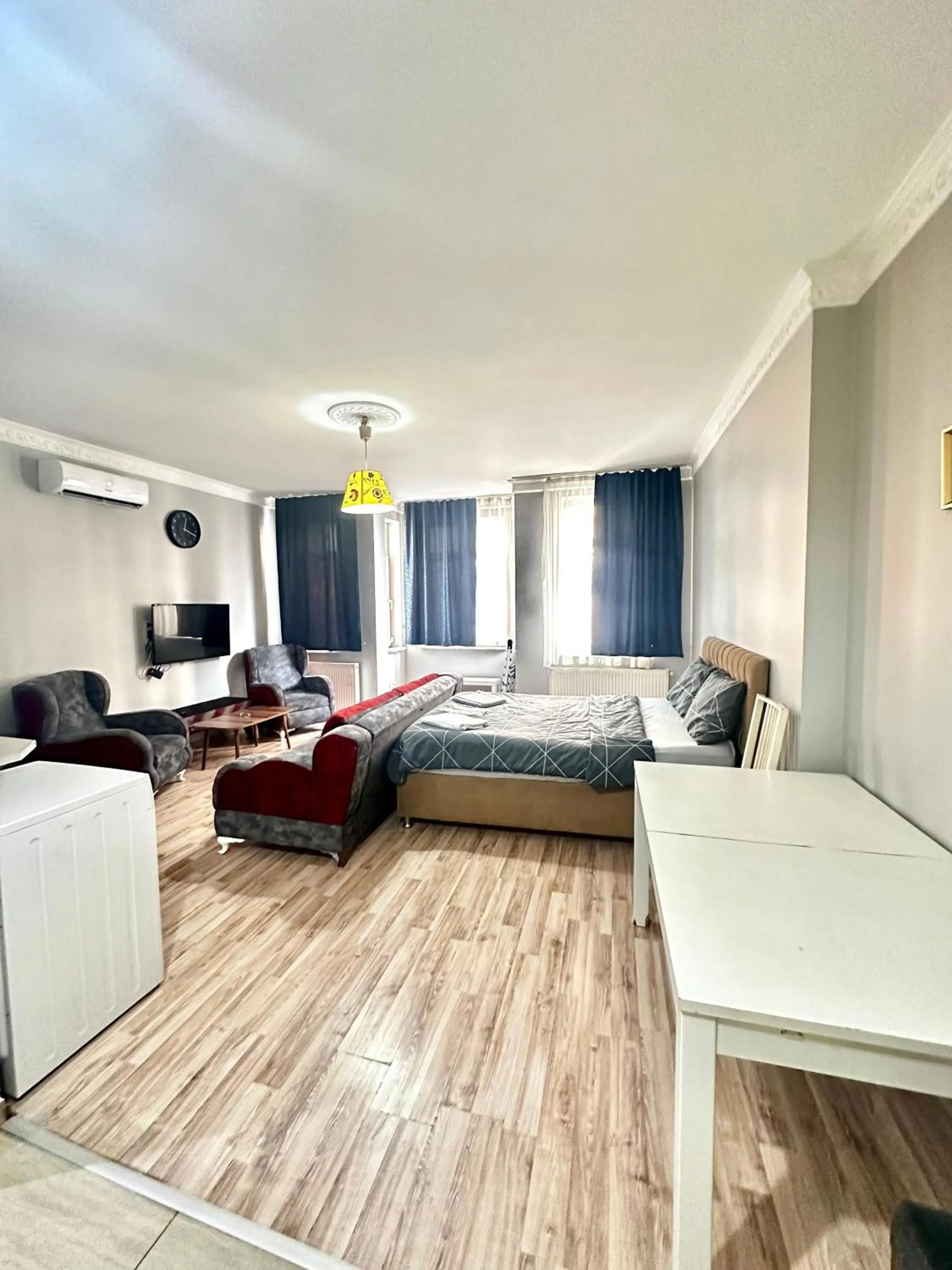 Communal lounge/ TV room, Bed in Blueway Hotel Residence