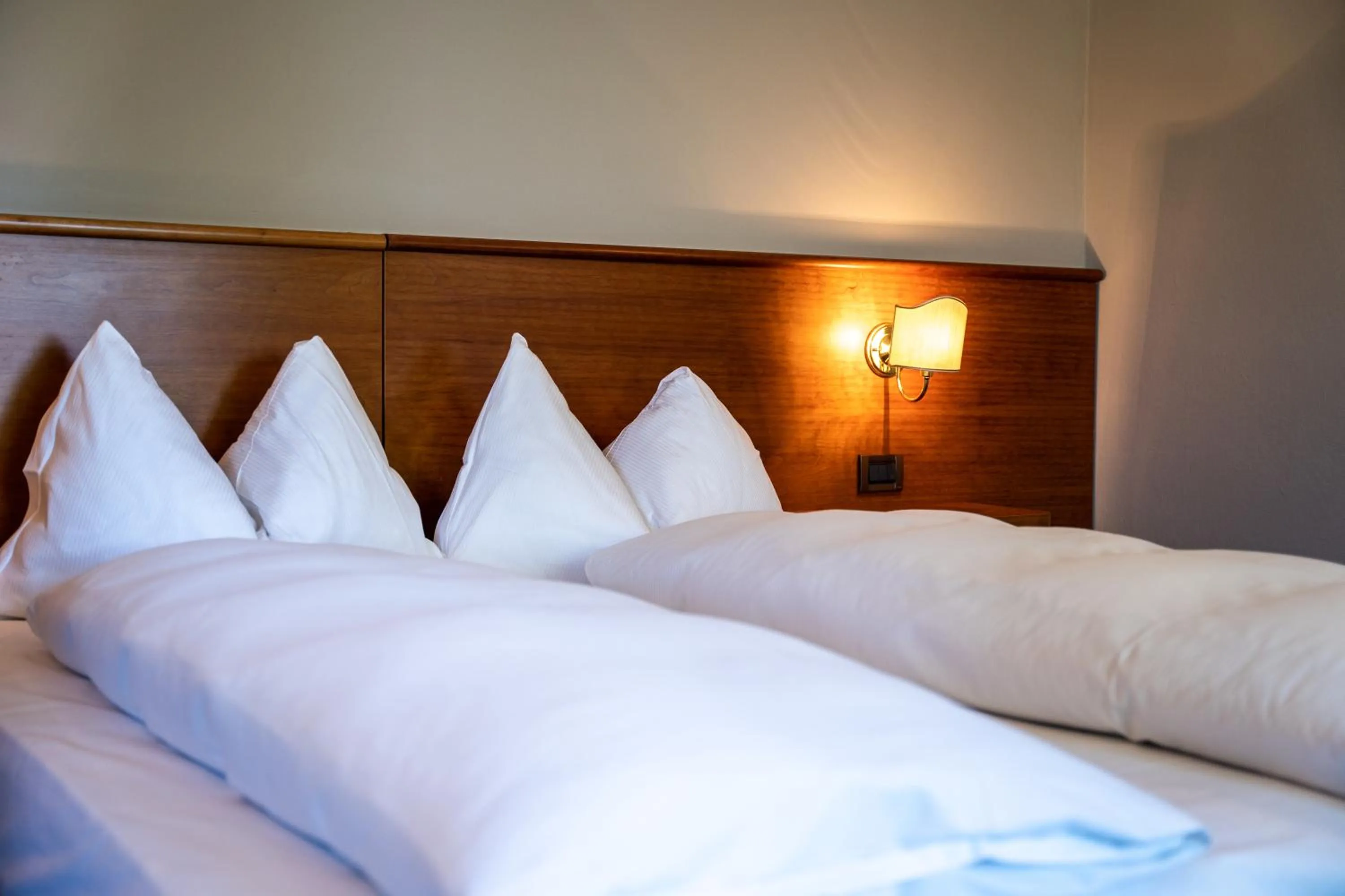 Bed in PanoramaHotel Penegal