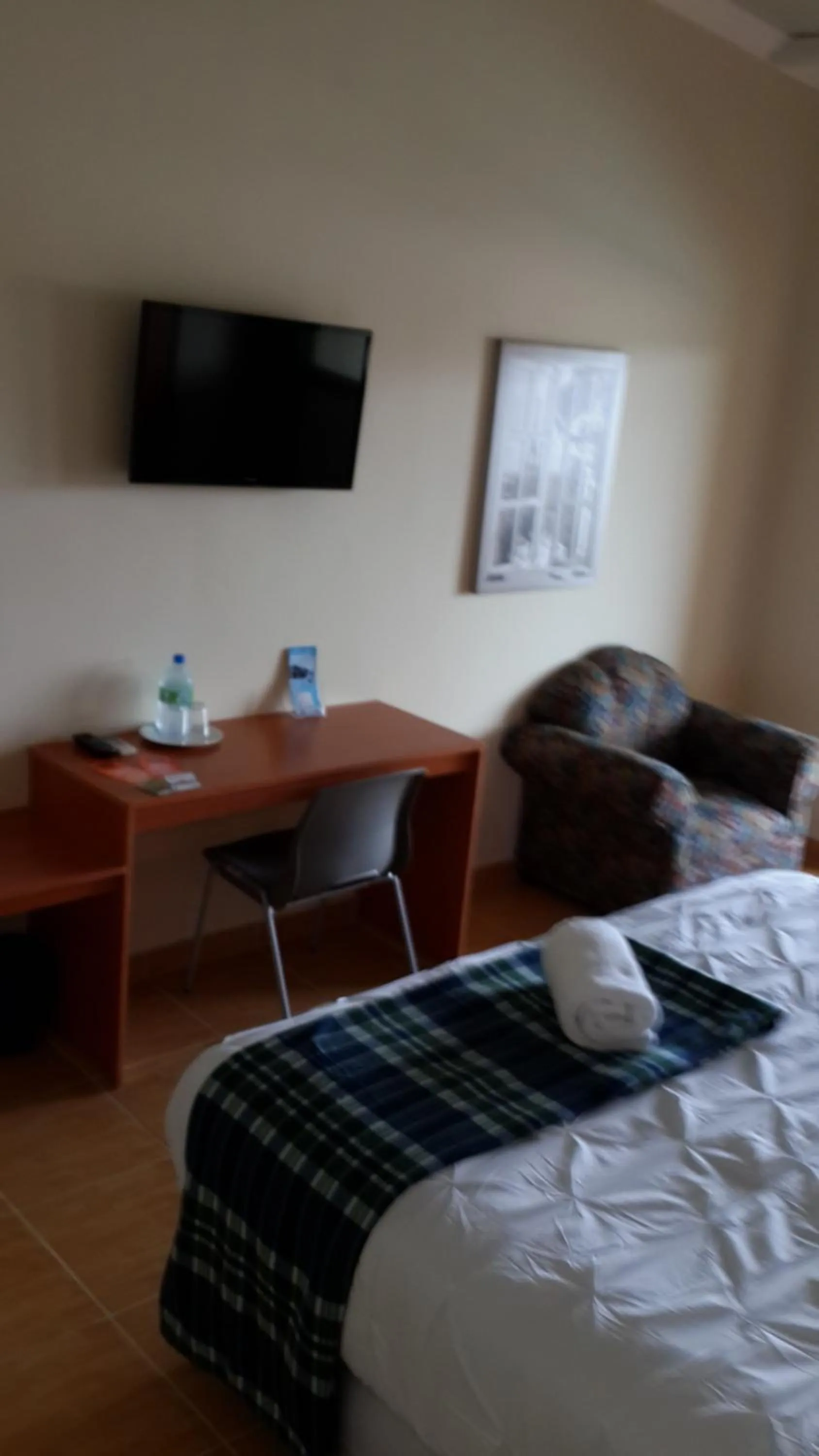 Decorative detail, Bed in Express Inn Coronado & Camping