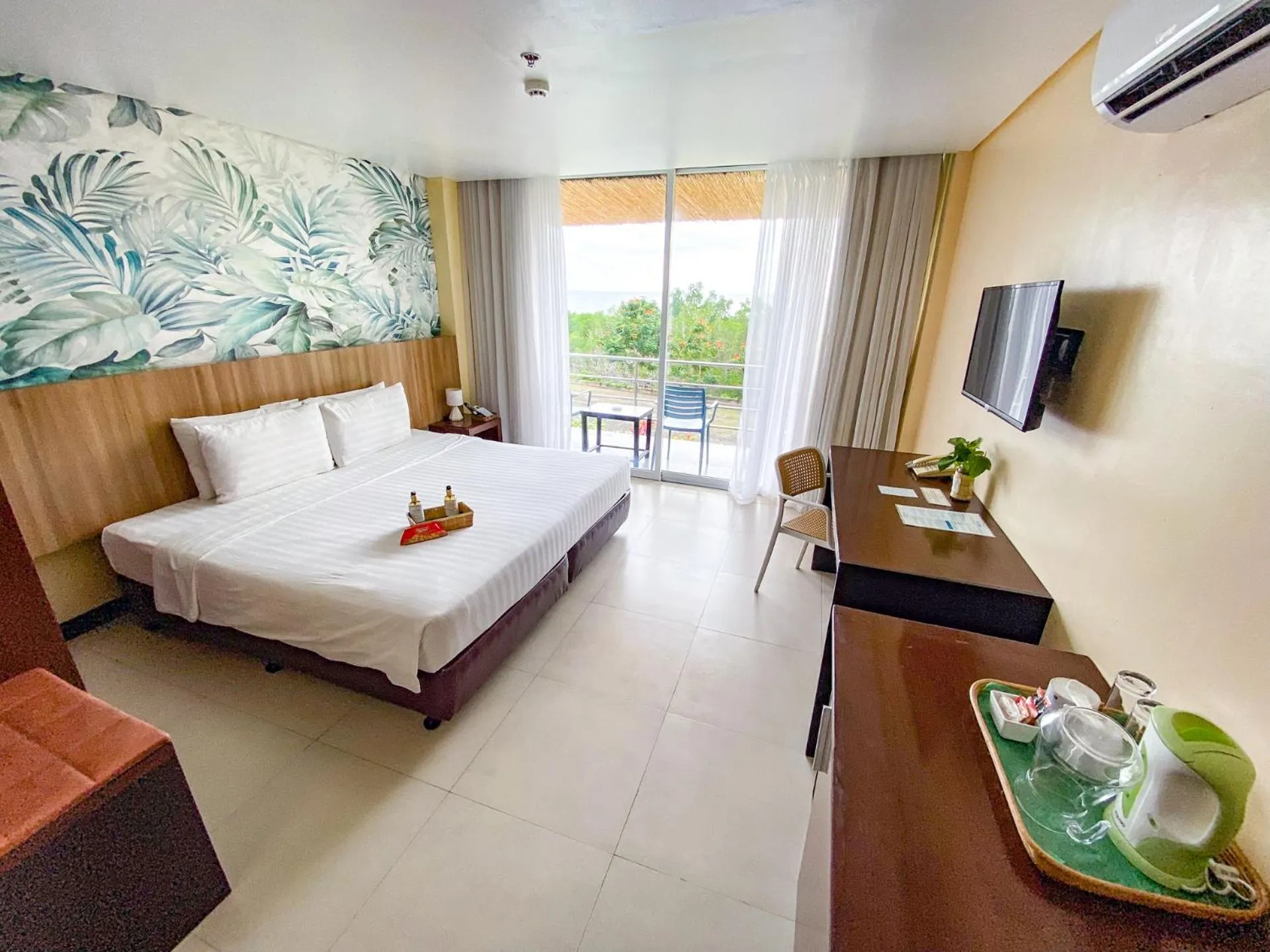 Bed in Ocean Suites Bohol Boutique Hotel