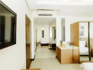 Bed in Ocean Suites Bohol Boutique Hotel