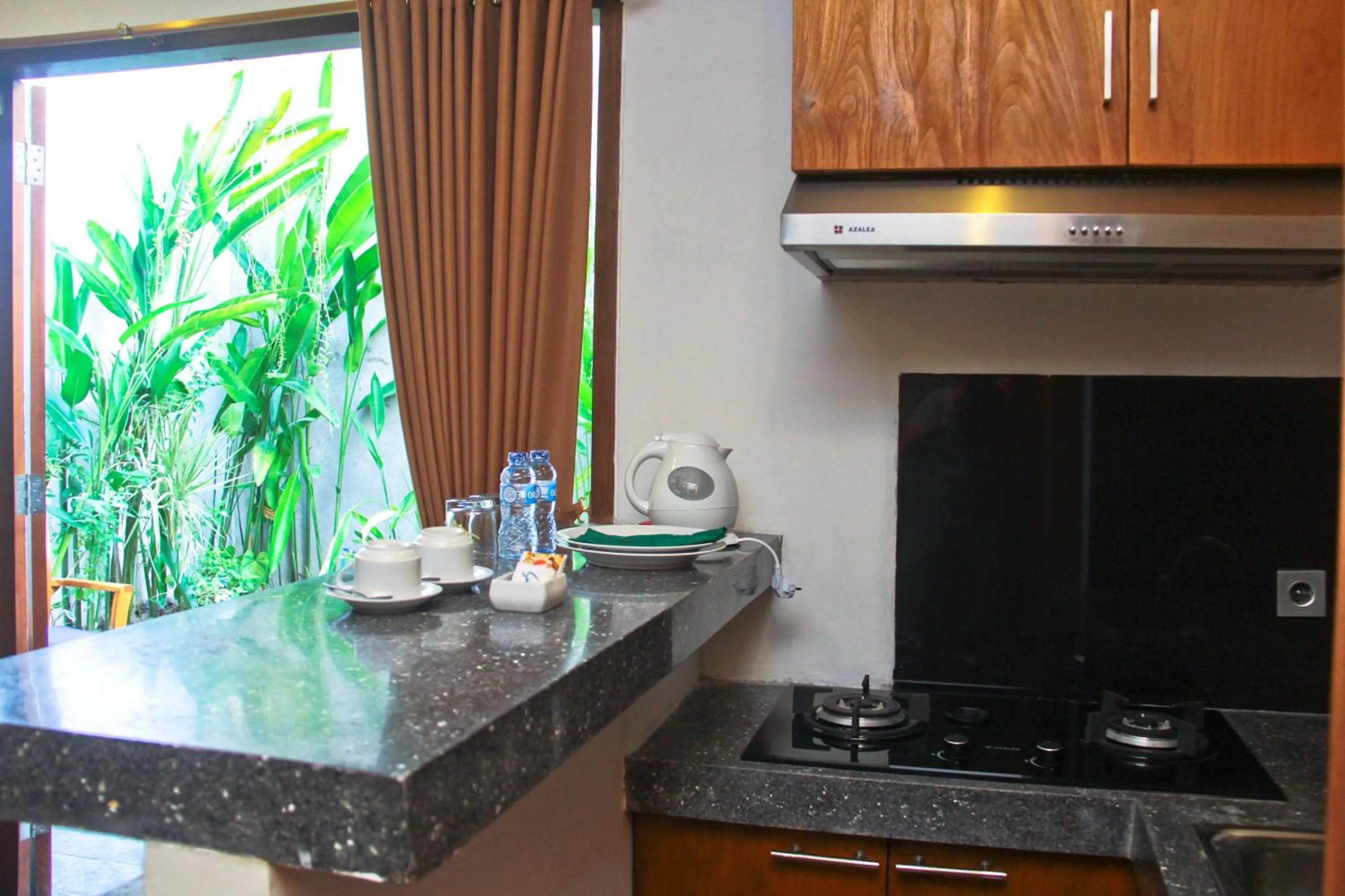 Kitchen or kitchenette in Delu Villas & Suite