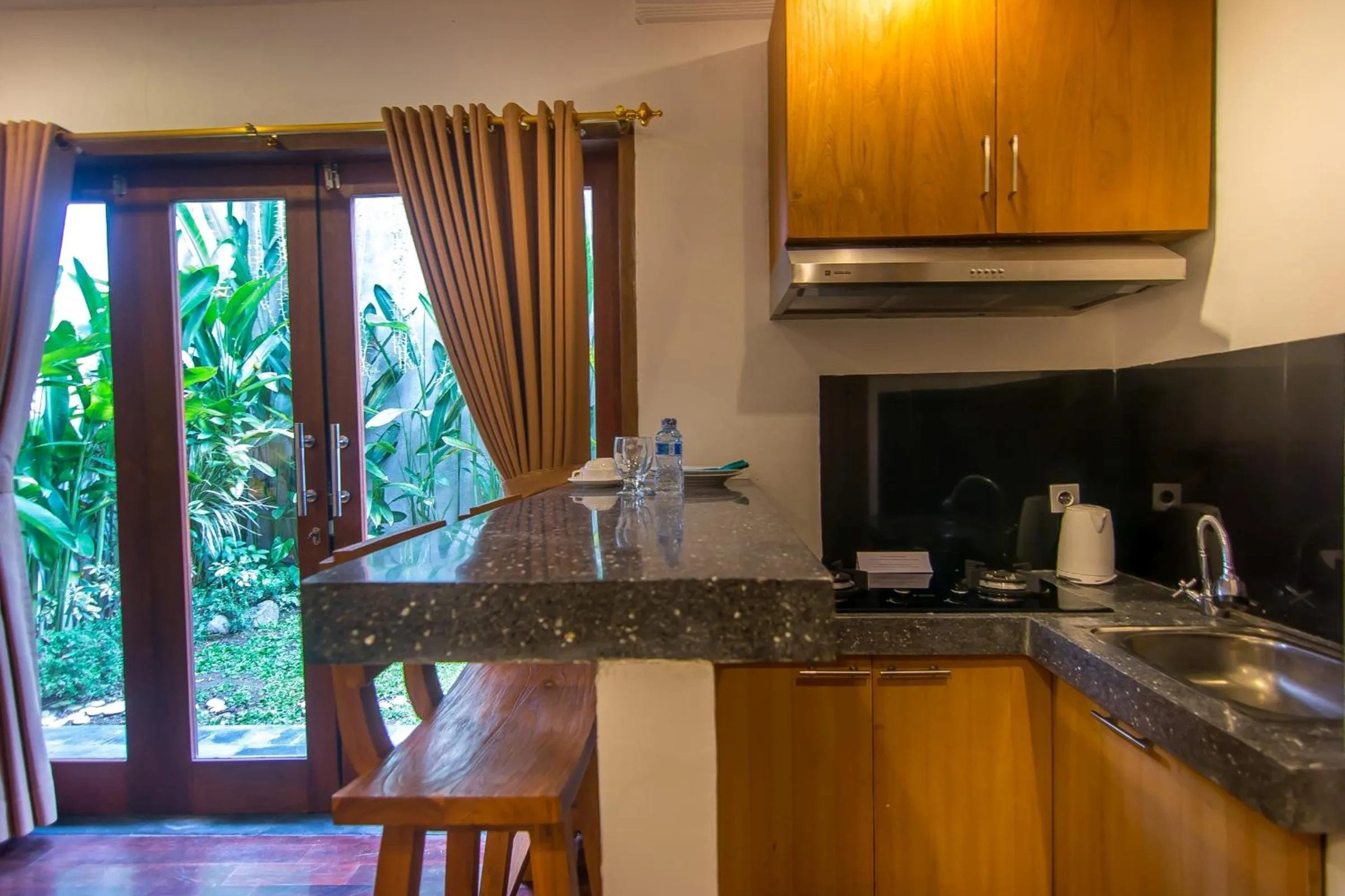 Kitchen or kitchenette in Delu Villas & Suite