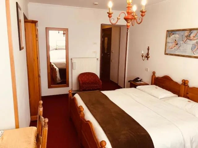 Bed in Hotel Paradiso