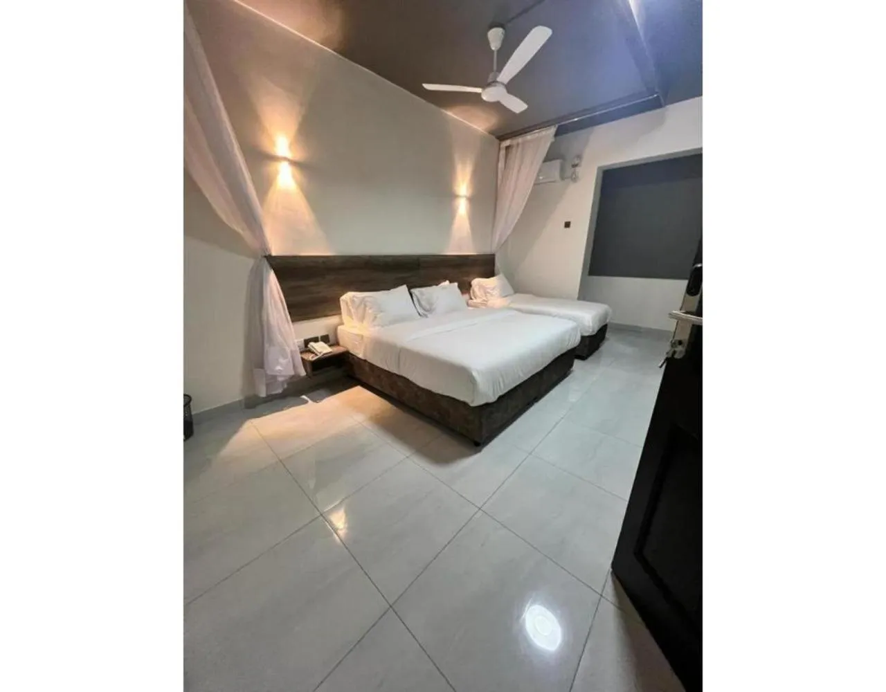 Bed in The Ivory Suites