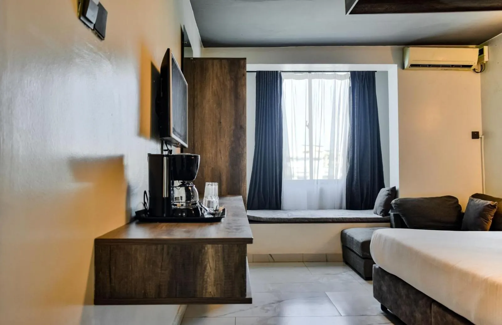 Bed in The Ivory Suites