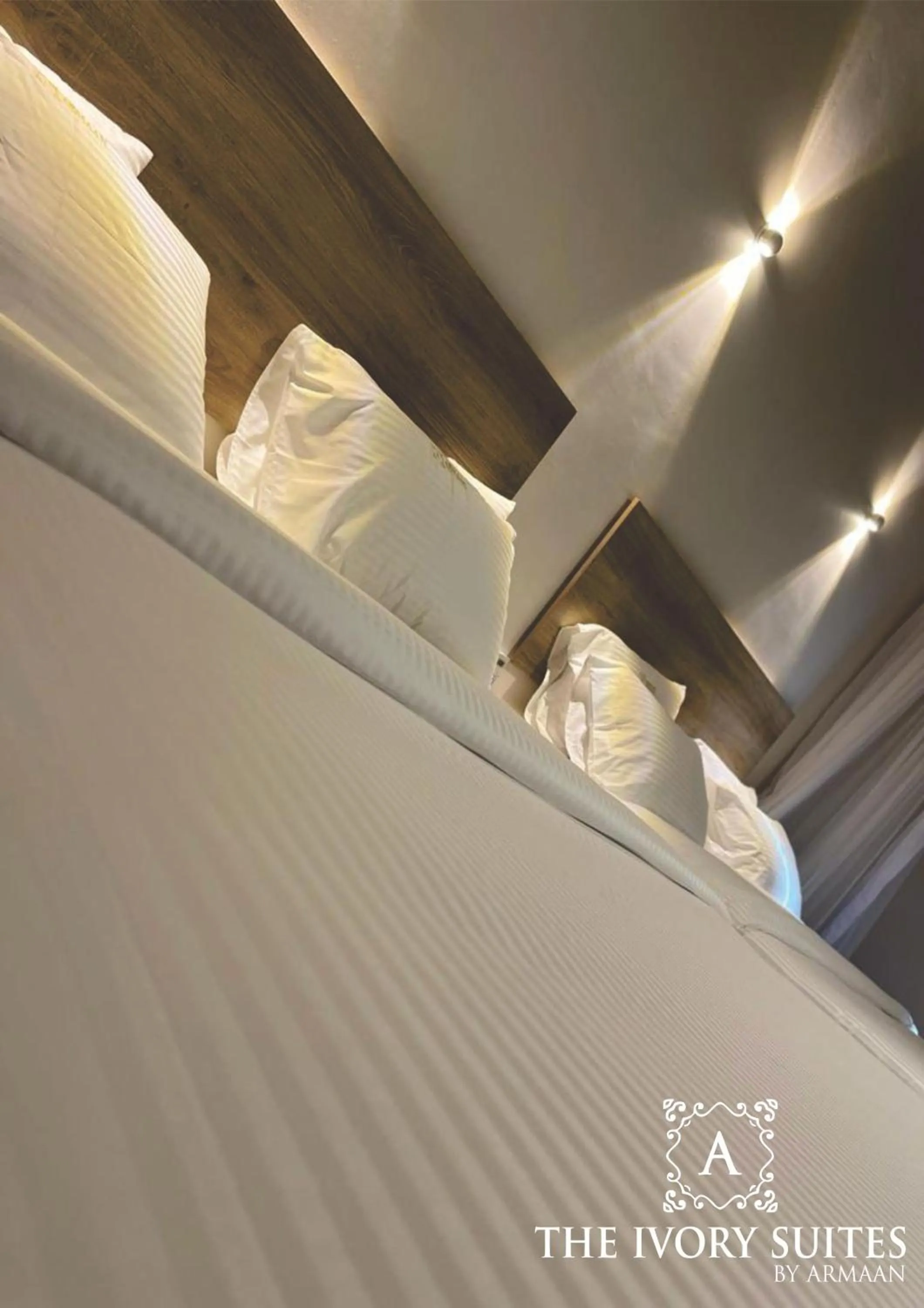 Bed in The Ivory Suites