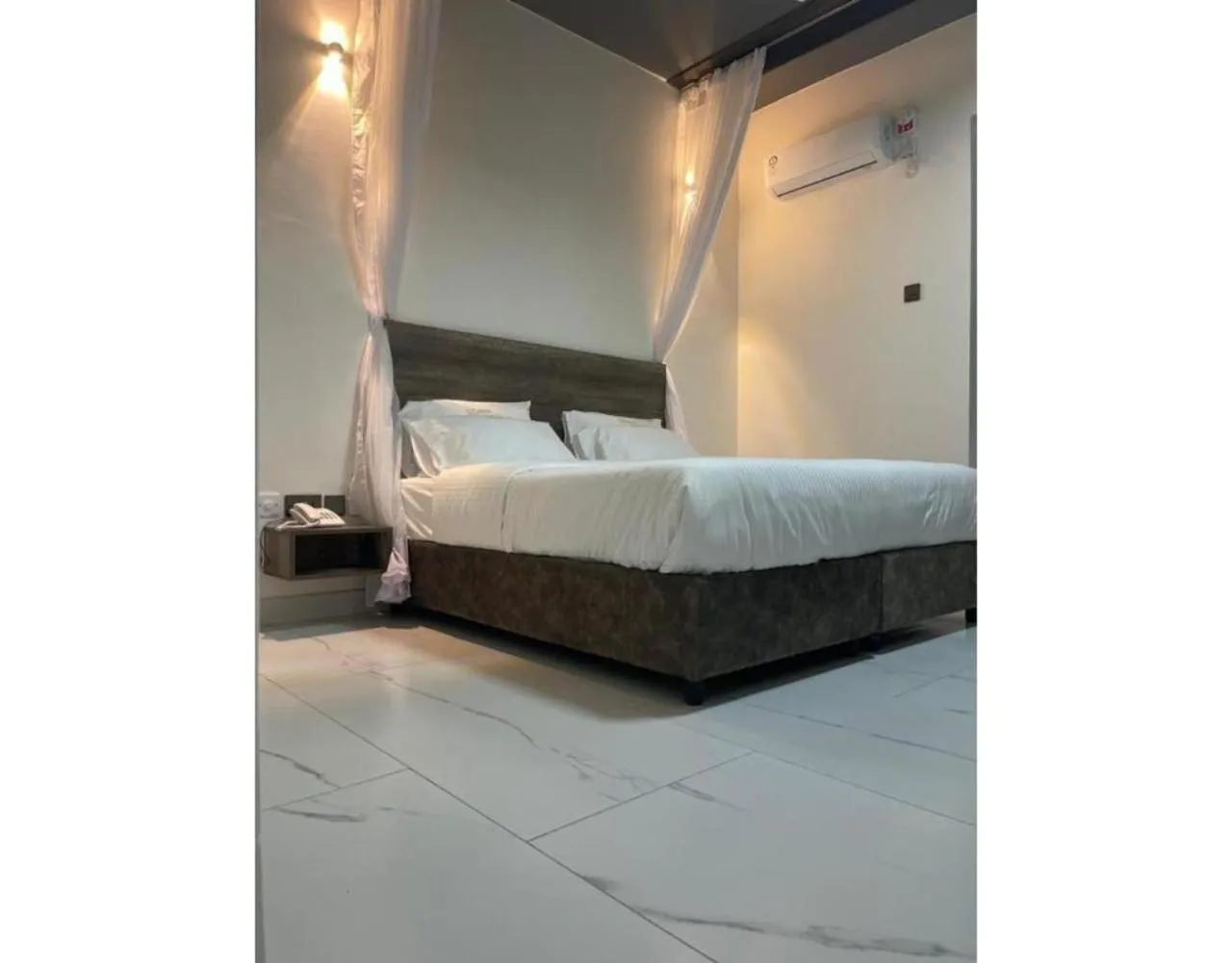 Bed in The Ivory Suites