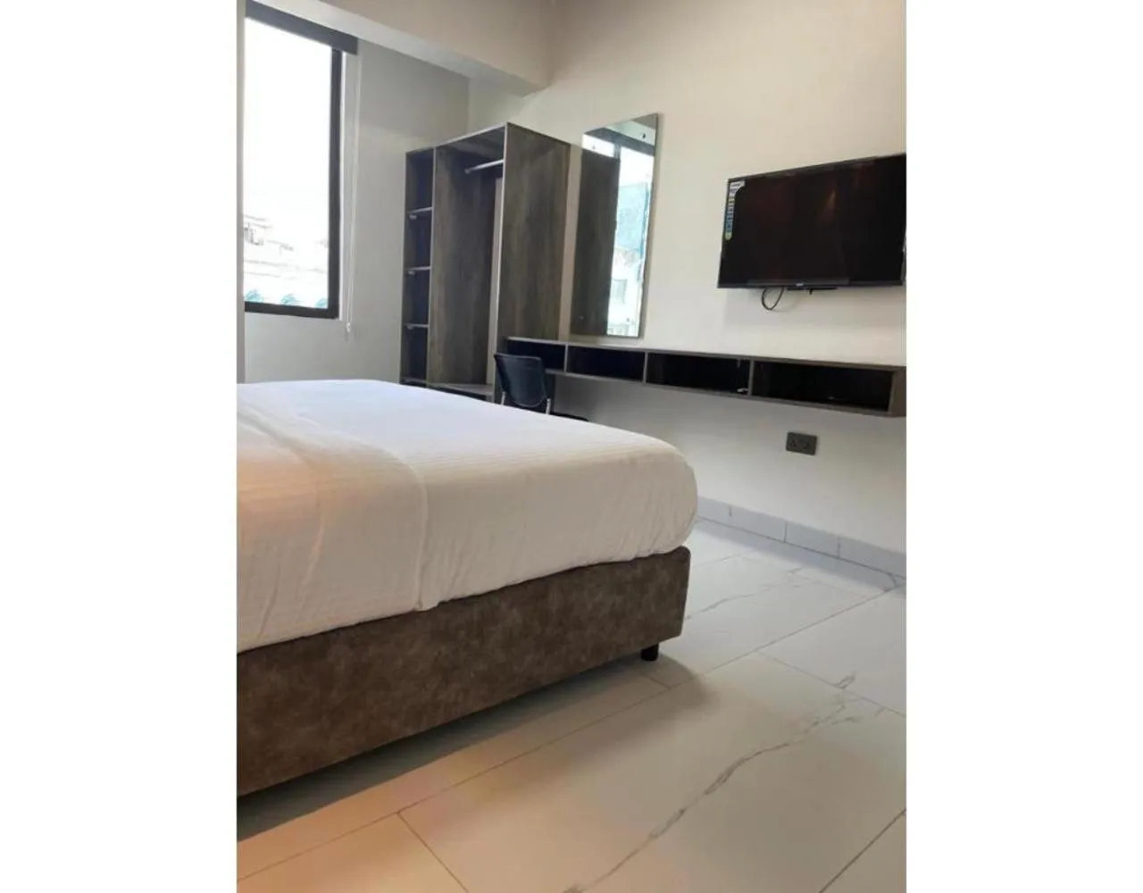 Bed in The Ivory Suites